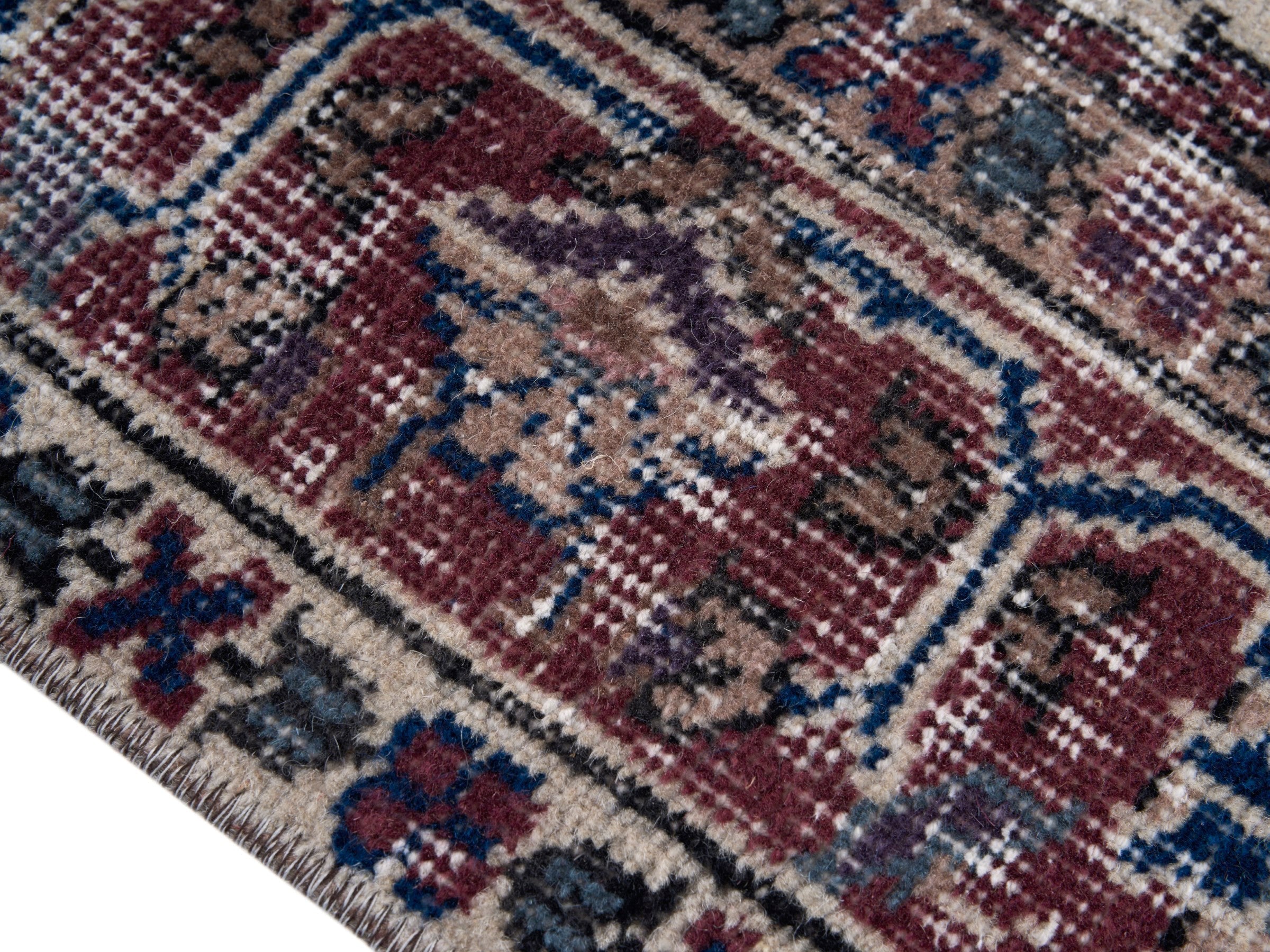 Turkish Isparta area rug in navy and burgundy, view 6 of 10