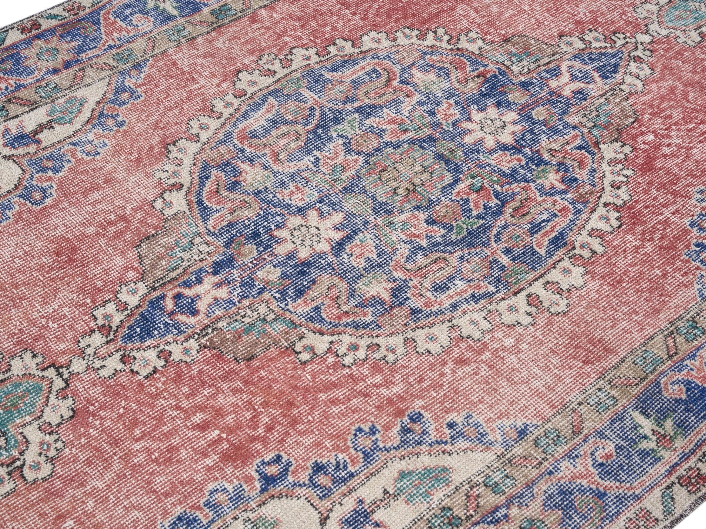 Turkish Isparta area rug in dusty rose and navy, view 5 of 10