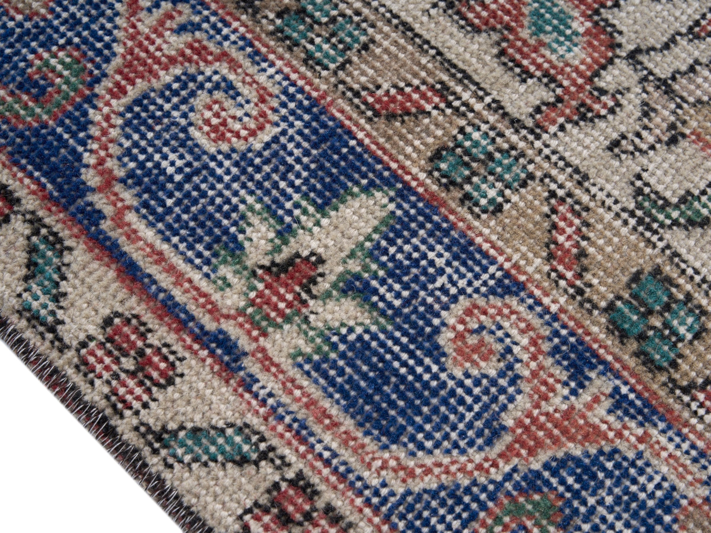 Turkish Isparta area rug in dusty rose and navy, view 6 of 10
