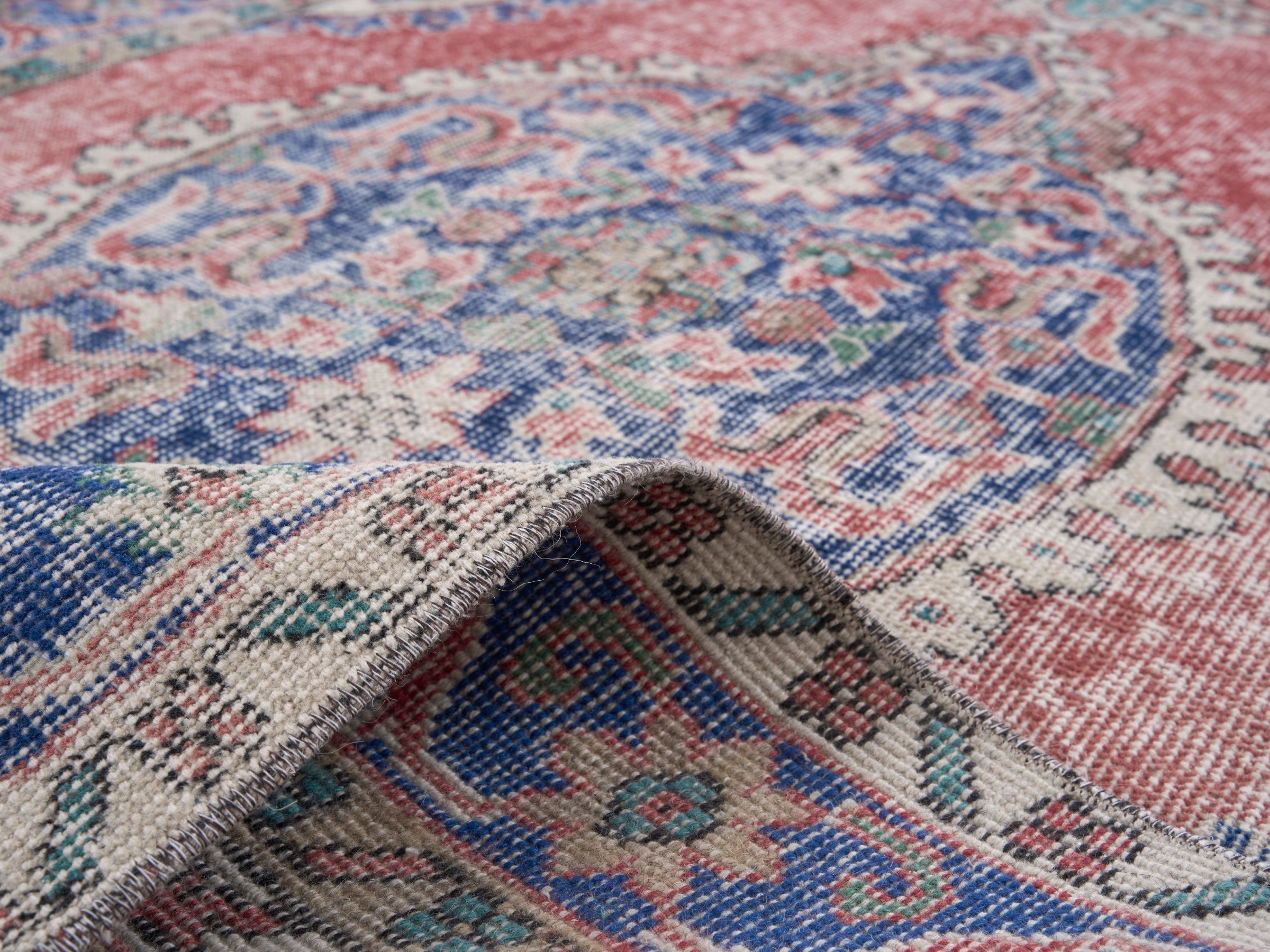Turkish Isparta area rug in dusty rose and navy, view 9 of 10