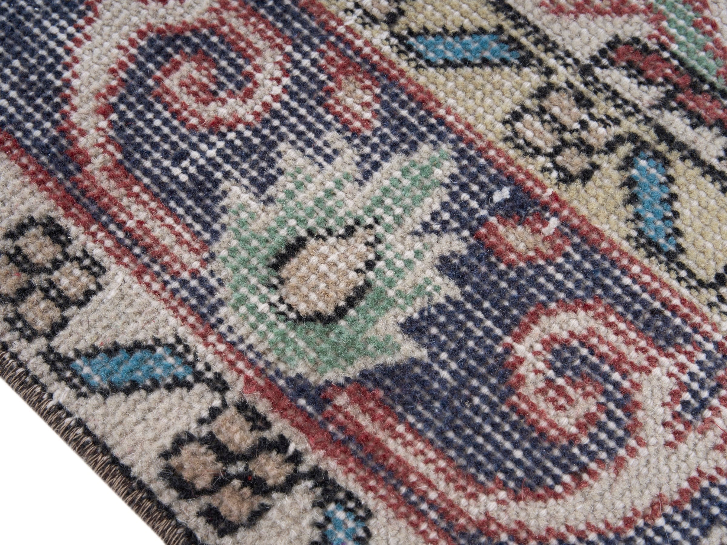 Turkish Isparta area rug in dusty rose and slate blue, view 6 of 10