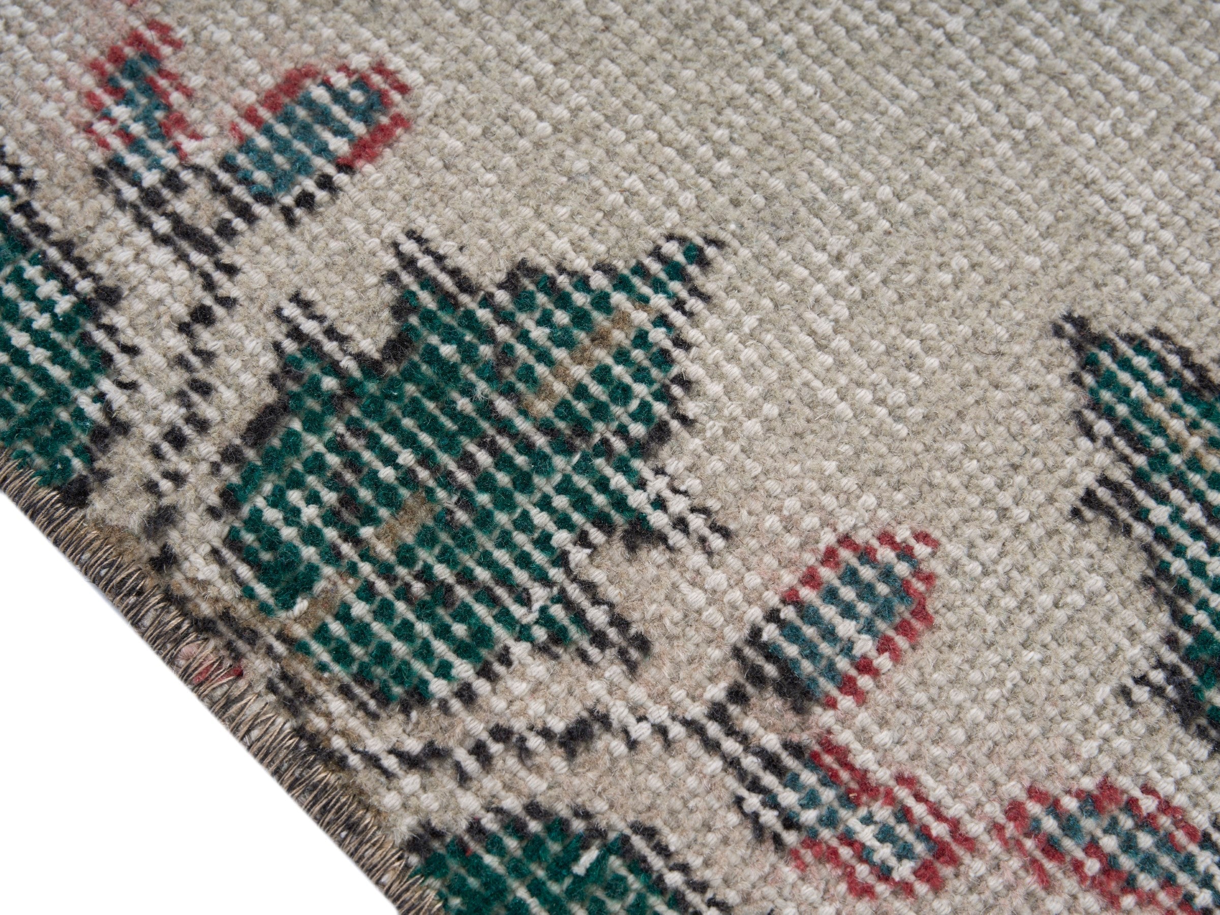 Turkish Isparta accent rug in muted pink and teal, view 6 of 10