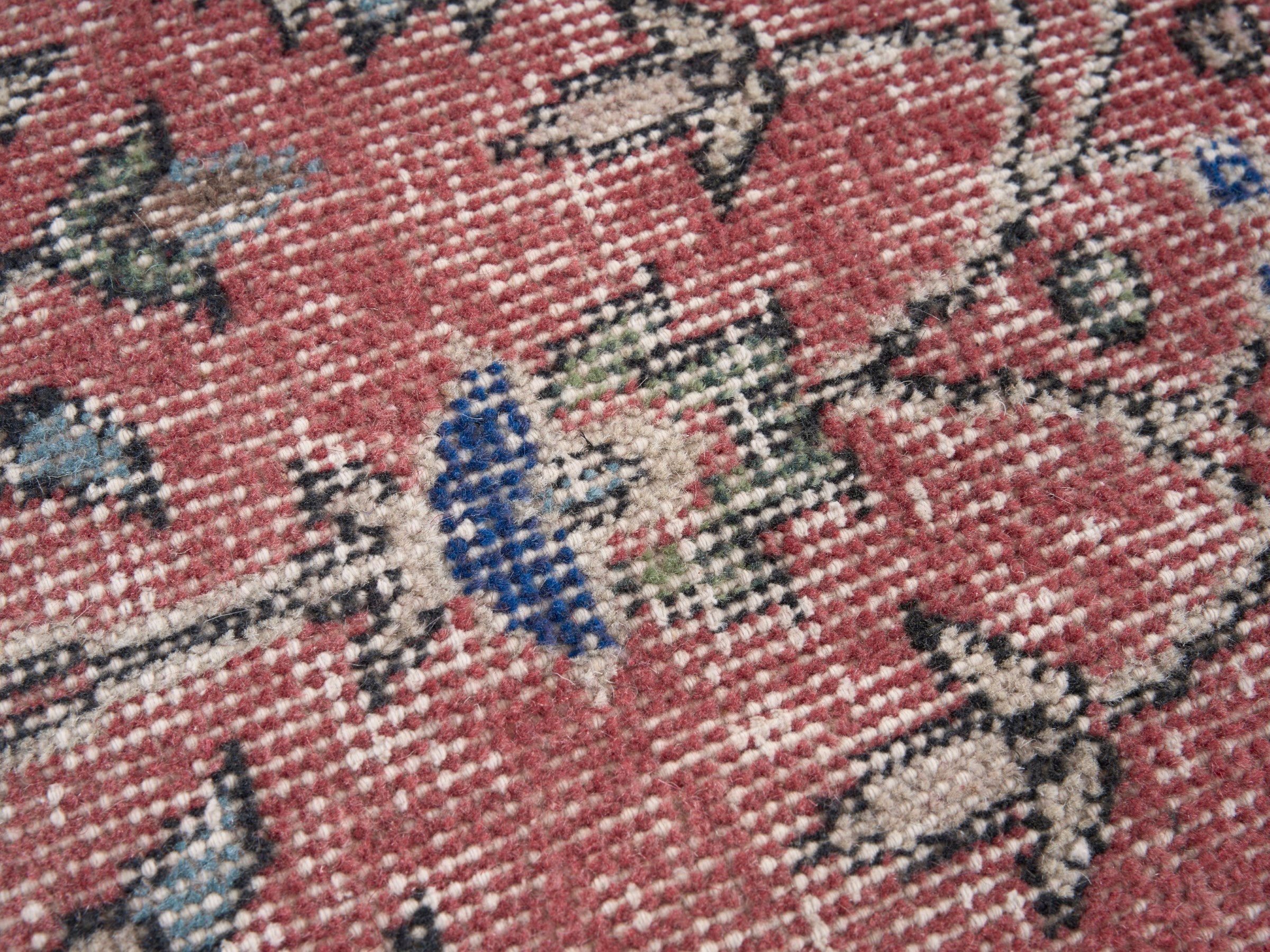 Turkish Isparta area rug in faded red and cream, view 7 of 10