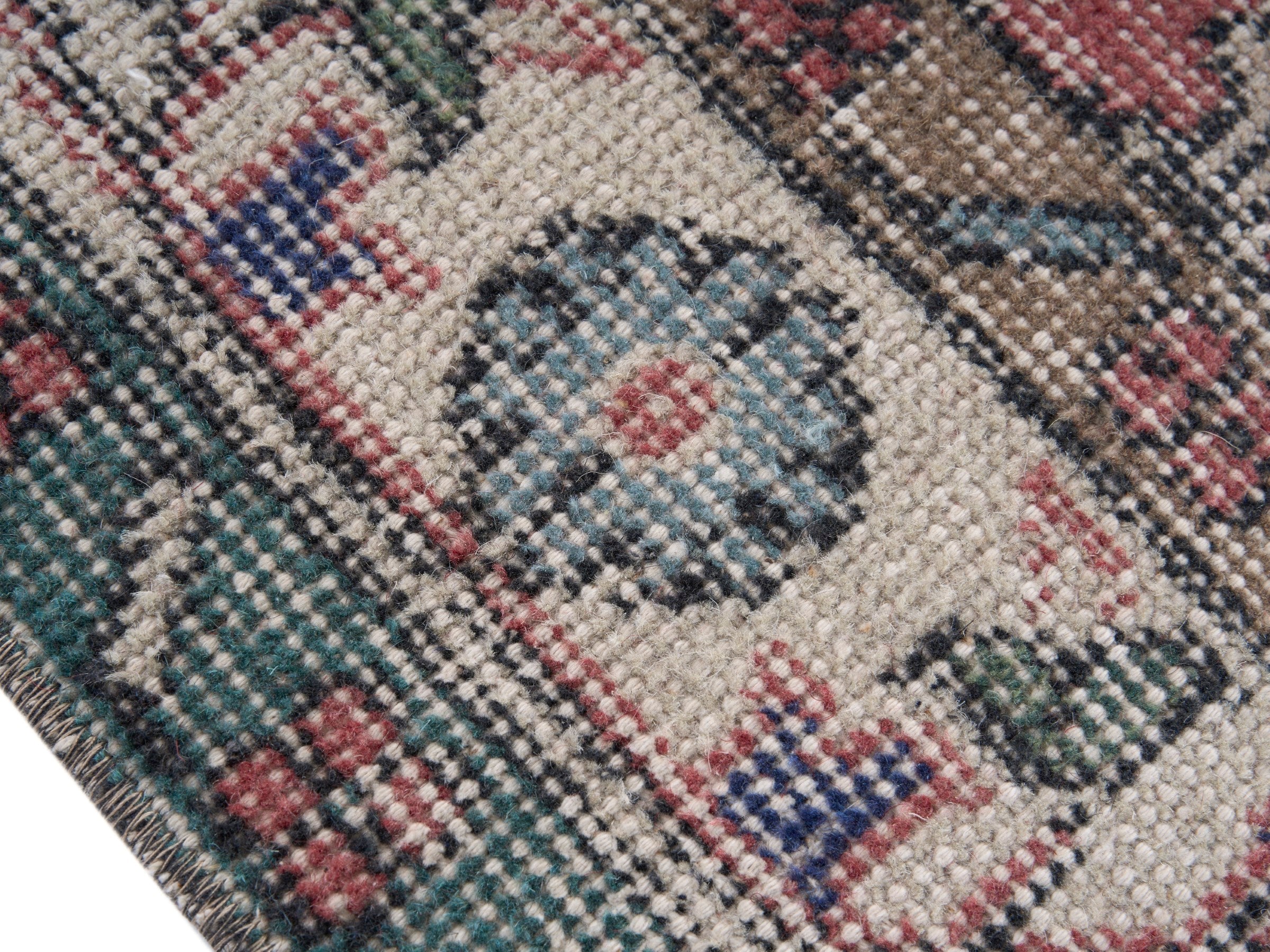 Turkish Isparta area rug in faded red and cream, view 6 of 10