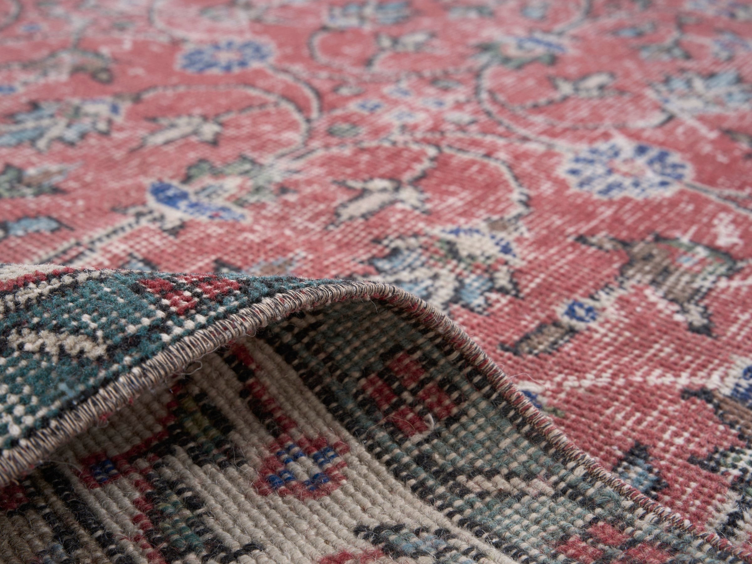 Turkish Isparta area rug in faded red and cream, view 9 of 10
