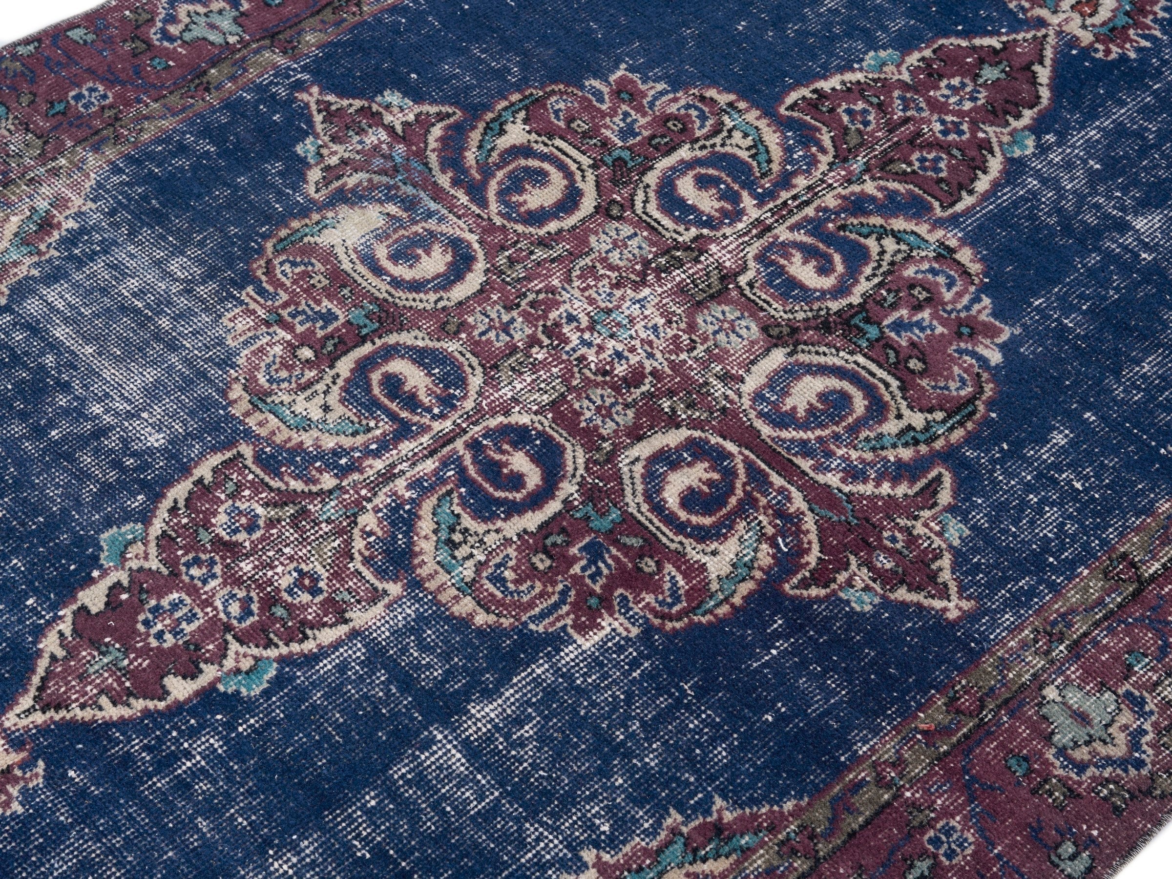 Turkish Isparta accent rug in navy and burgundy, view 5 of 10