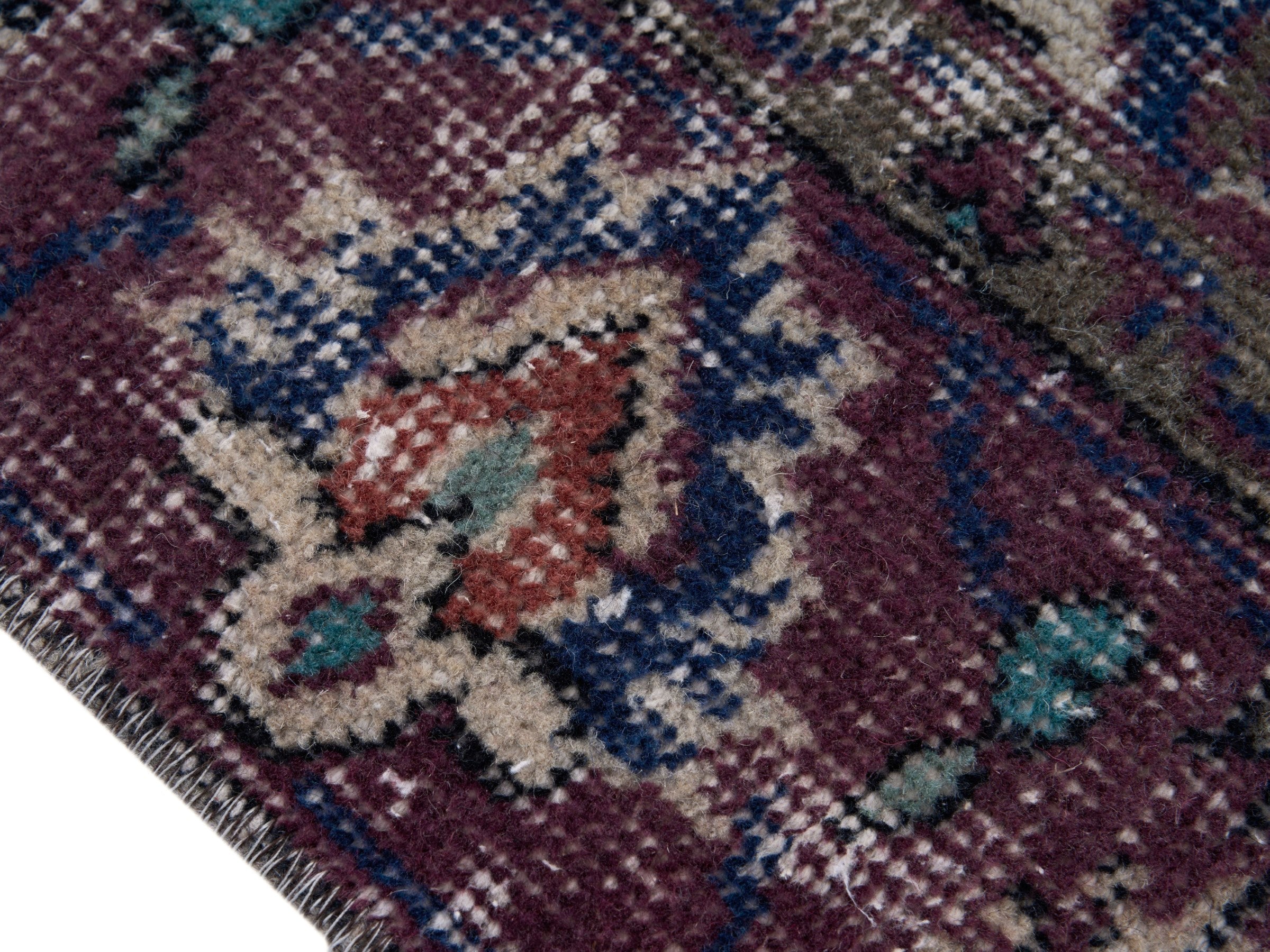 Turkish Isparta accent rug in navy and burgundy, view 6 of 10