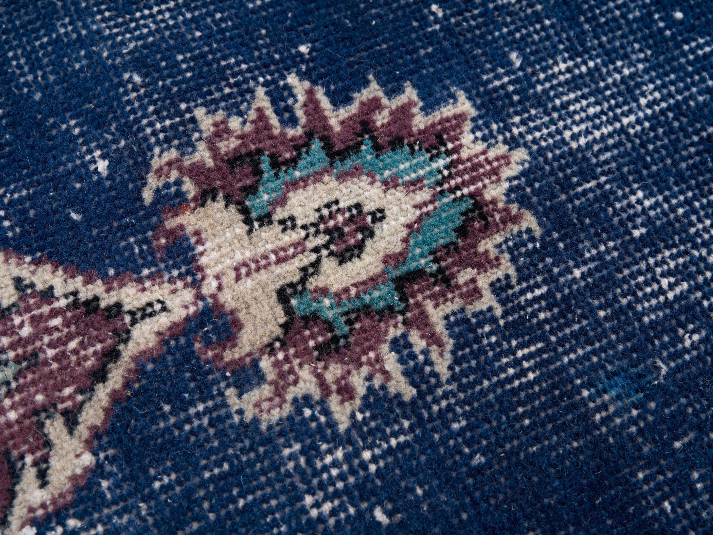 Turkish Isparta accent rug in navy and burgundy, view 7 of 10