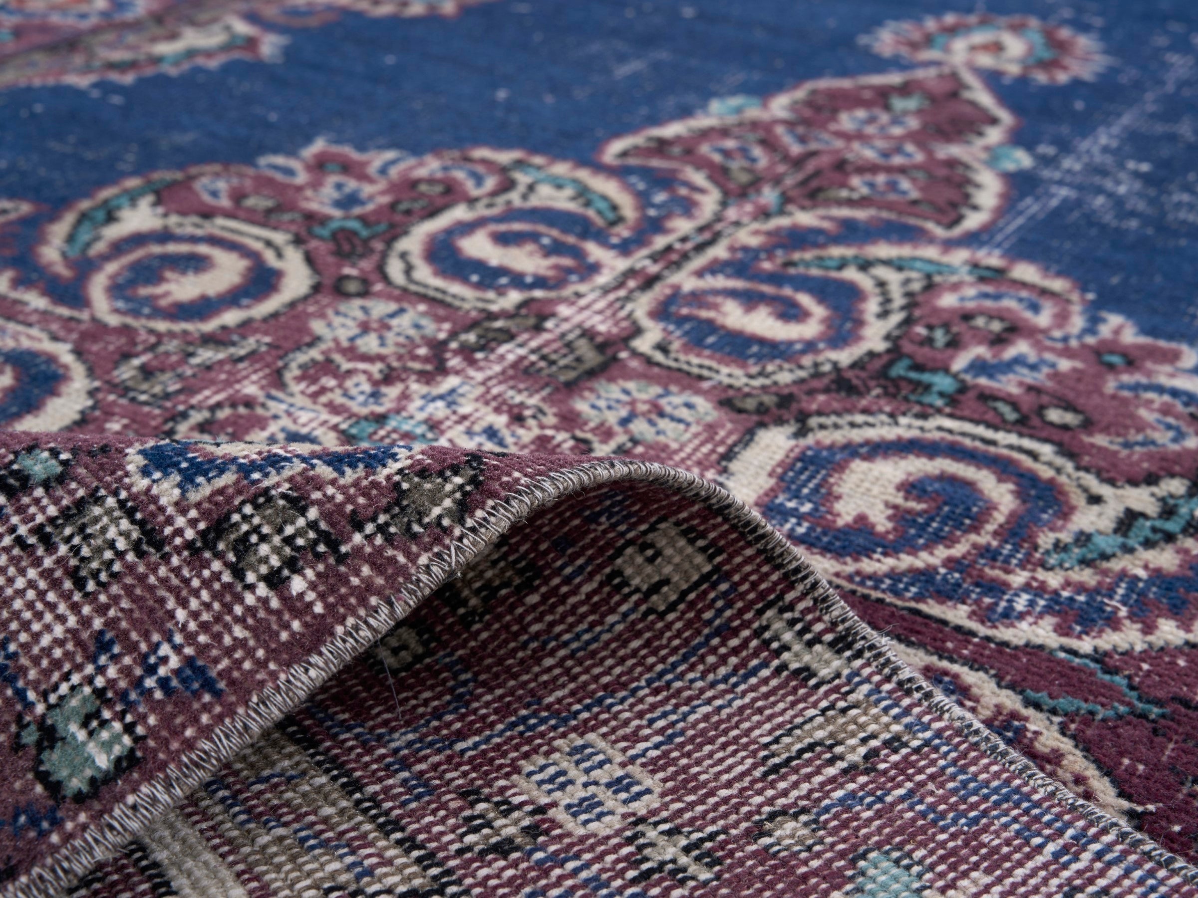 Turkish Isparta accent rug in navy and burgundy, view 9 of 10