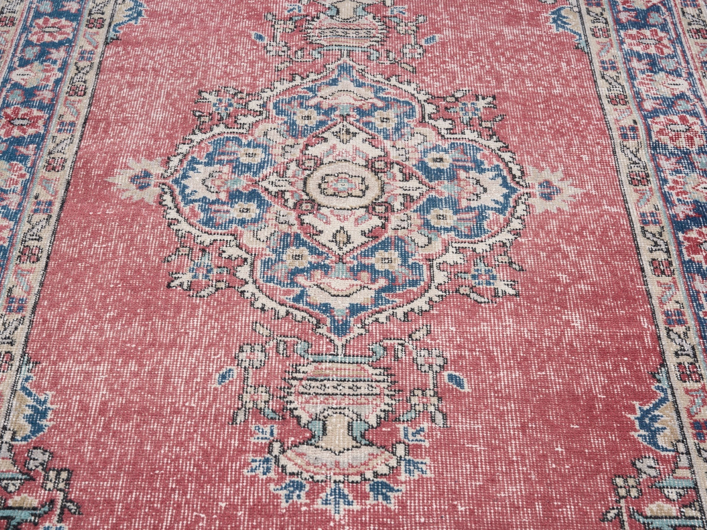 Turkish Isparta area rug in dusty rose and navy, view 4 of 10