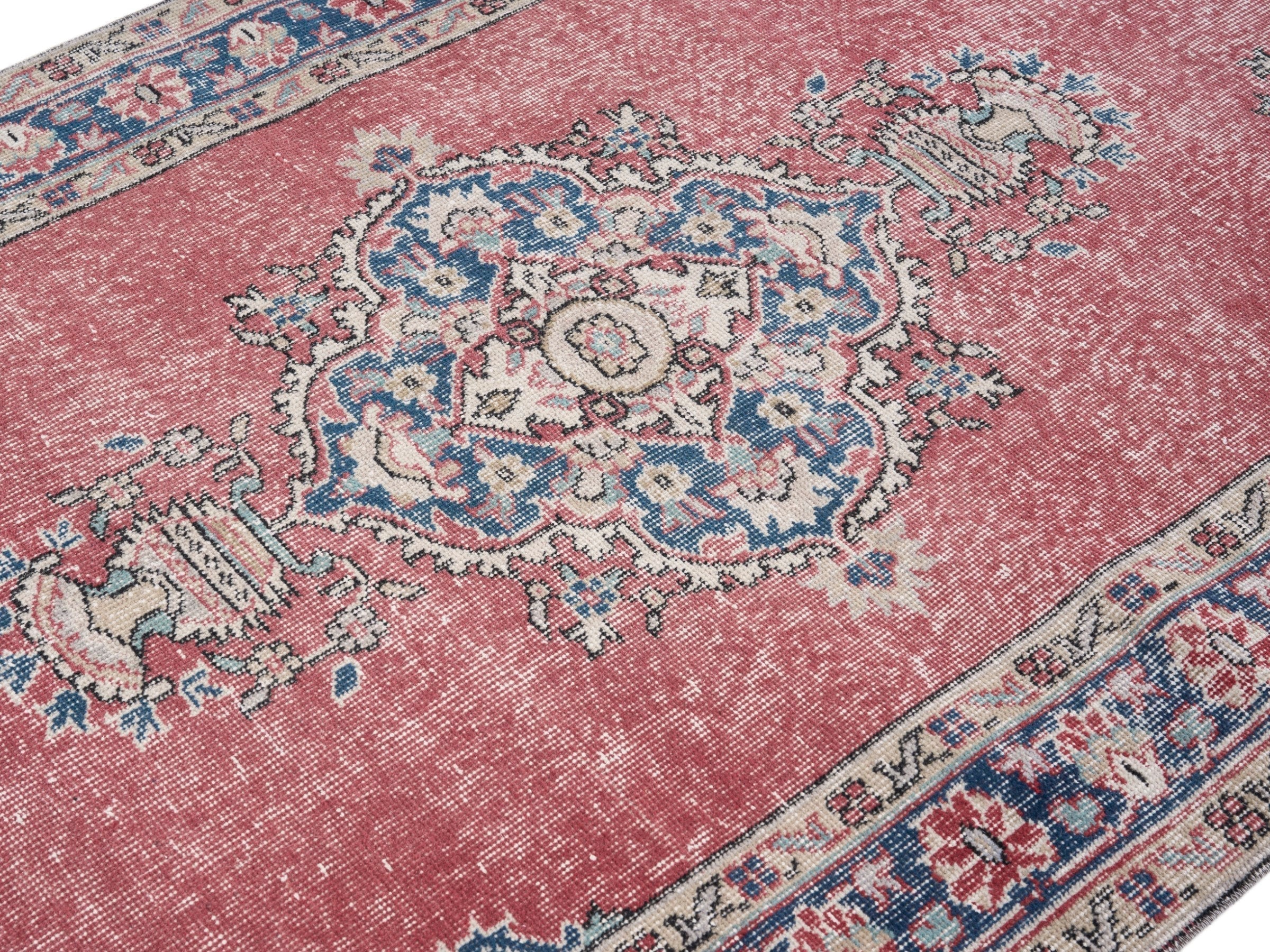 Turkish Isparta area rug in dusty rose and navy, view 5 of 10