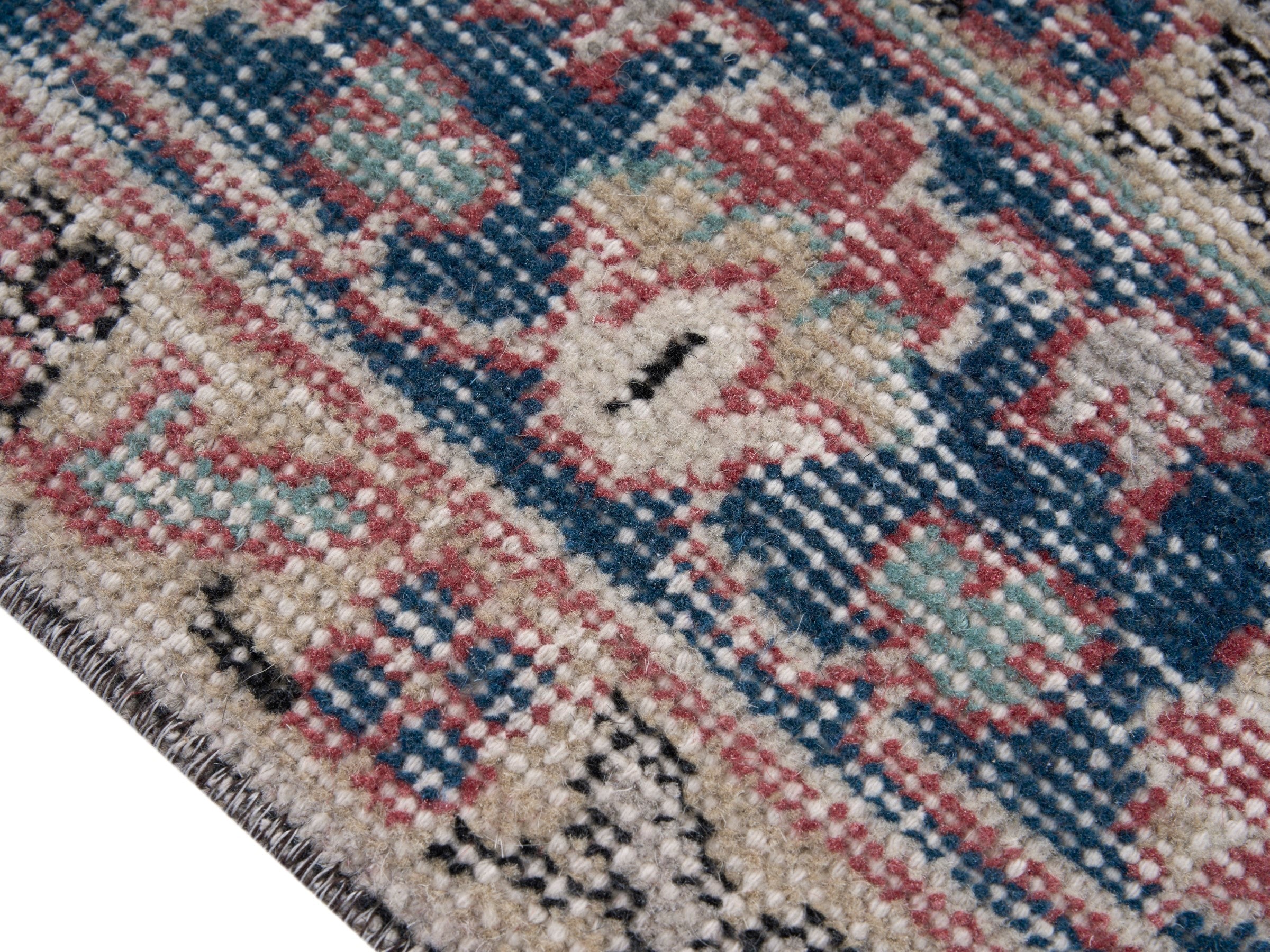 Turkish Isparta area rug in dusty rose and navy, view 6 of 10