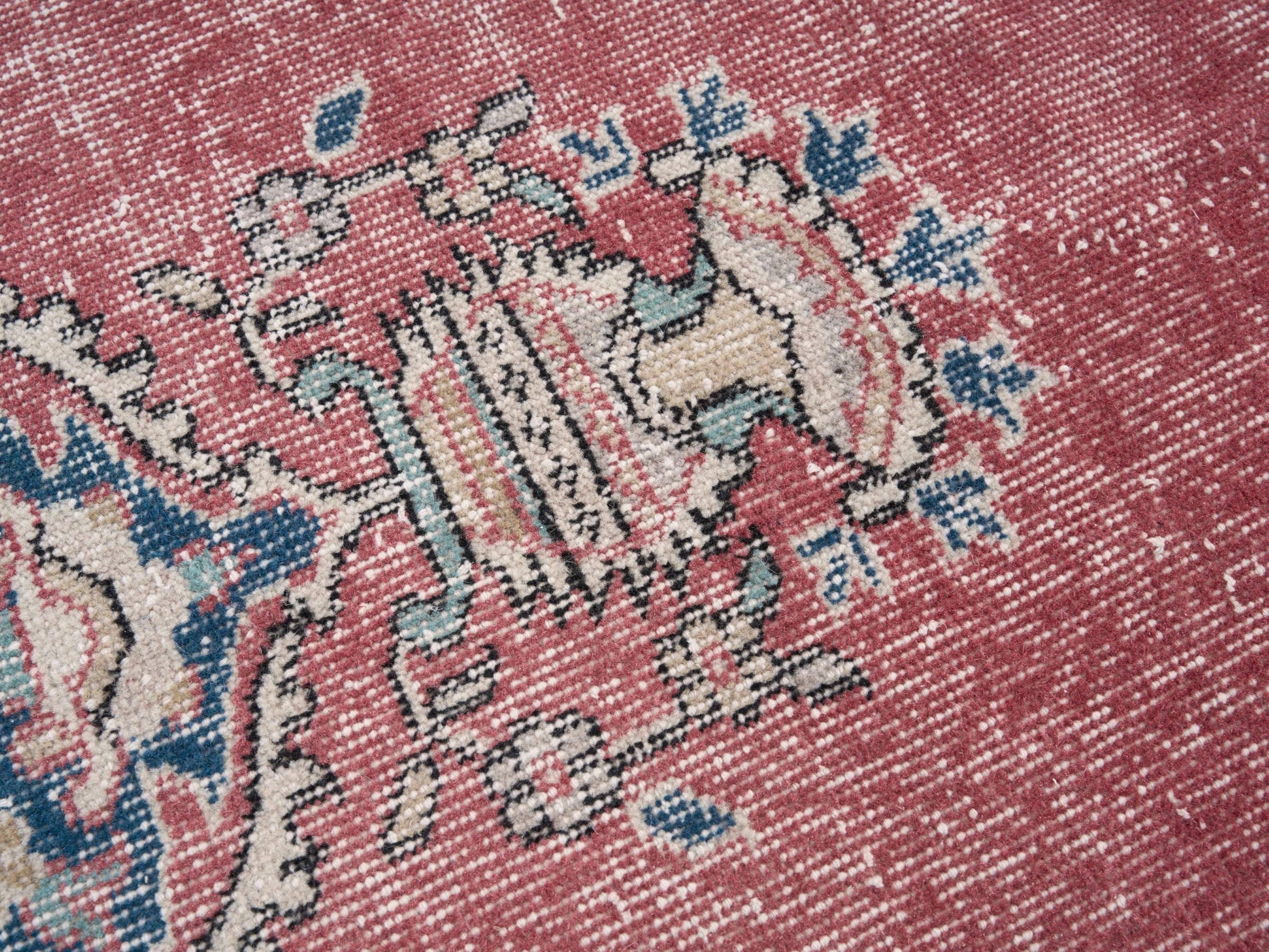 Turkish Isparta area rug in dusty rose and navy, view 7 of 10