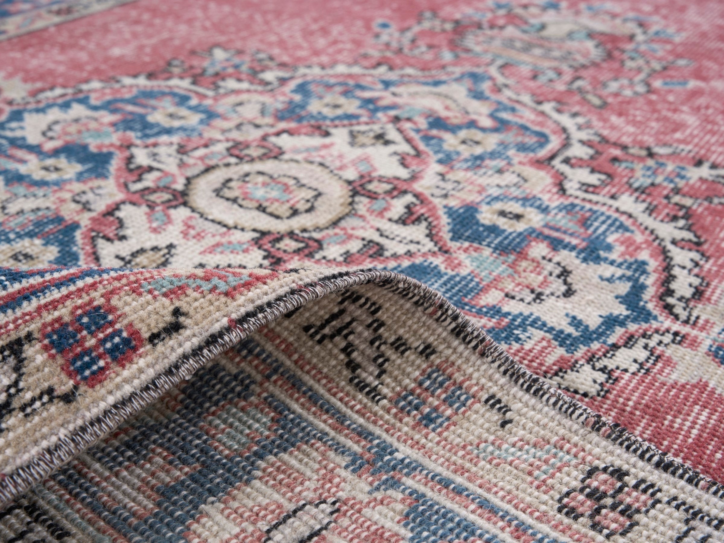Turkish Isparta area rug in dusty rose and navy, view 9 of 10