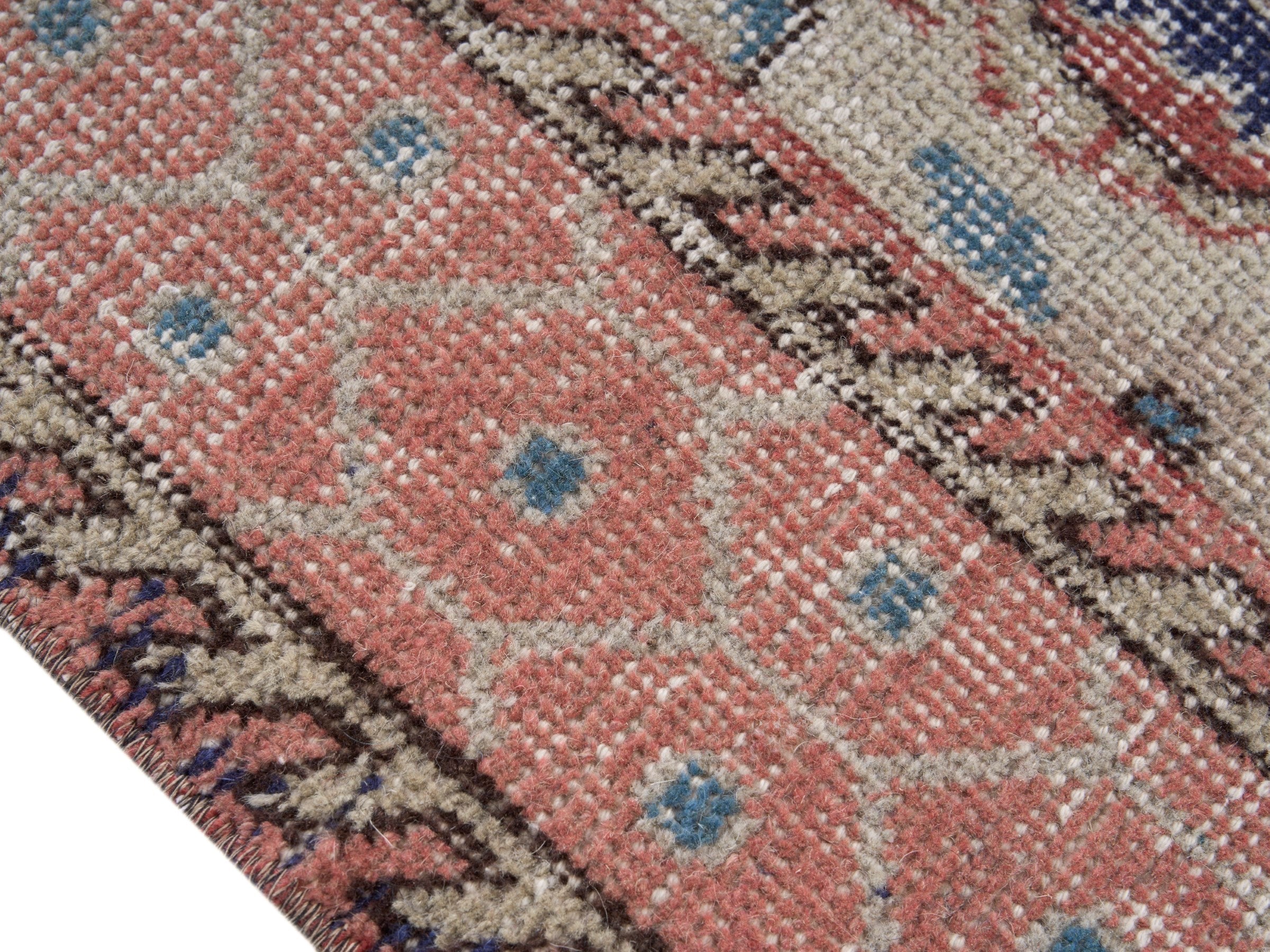 Turkish Isparta area rug in deep indigo and rose, view 6 of 10