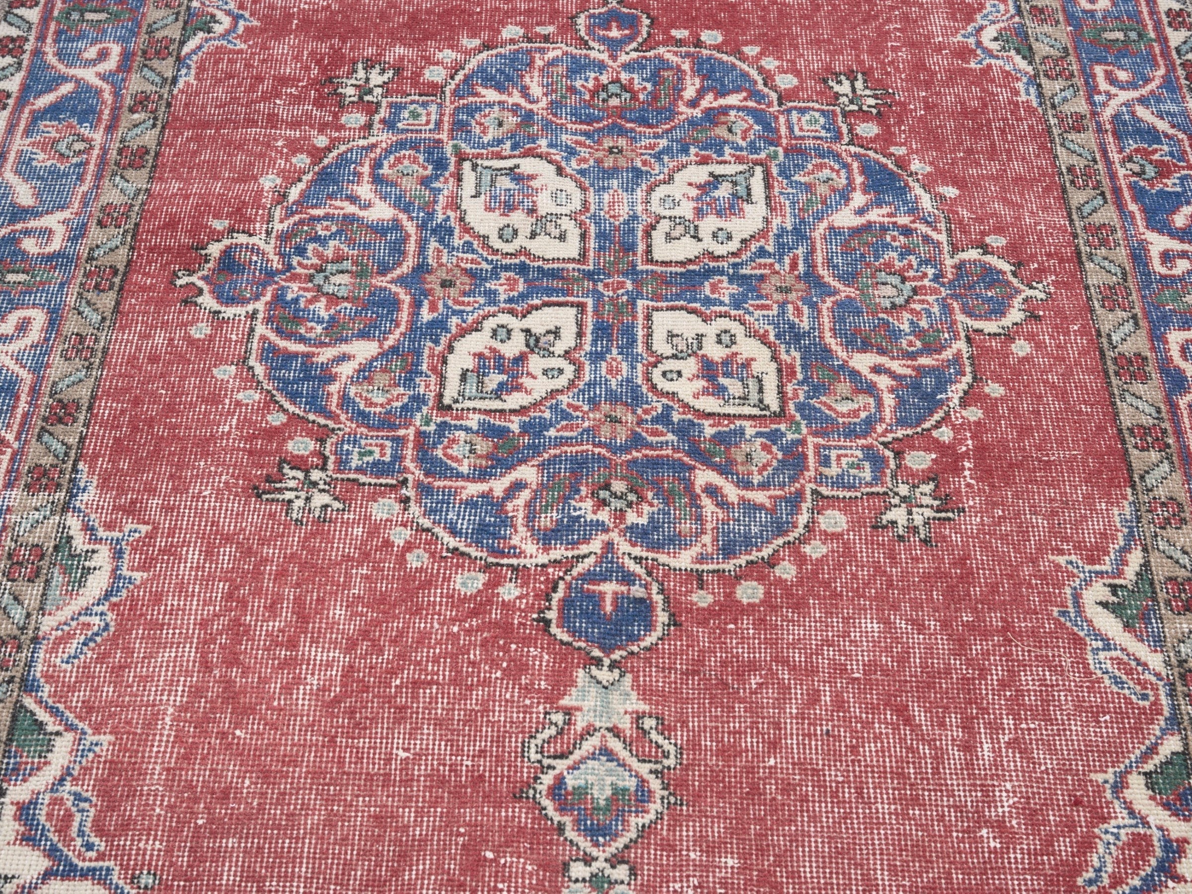Turkish Isparta area rug in rose and navy, view 4 of 10