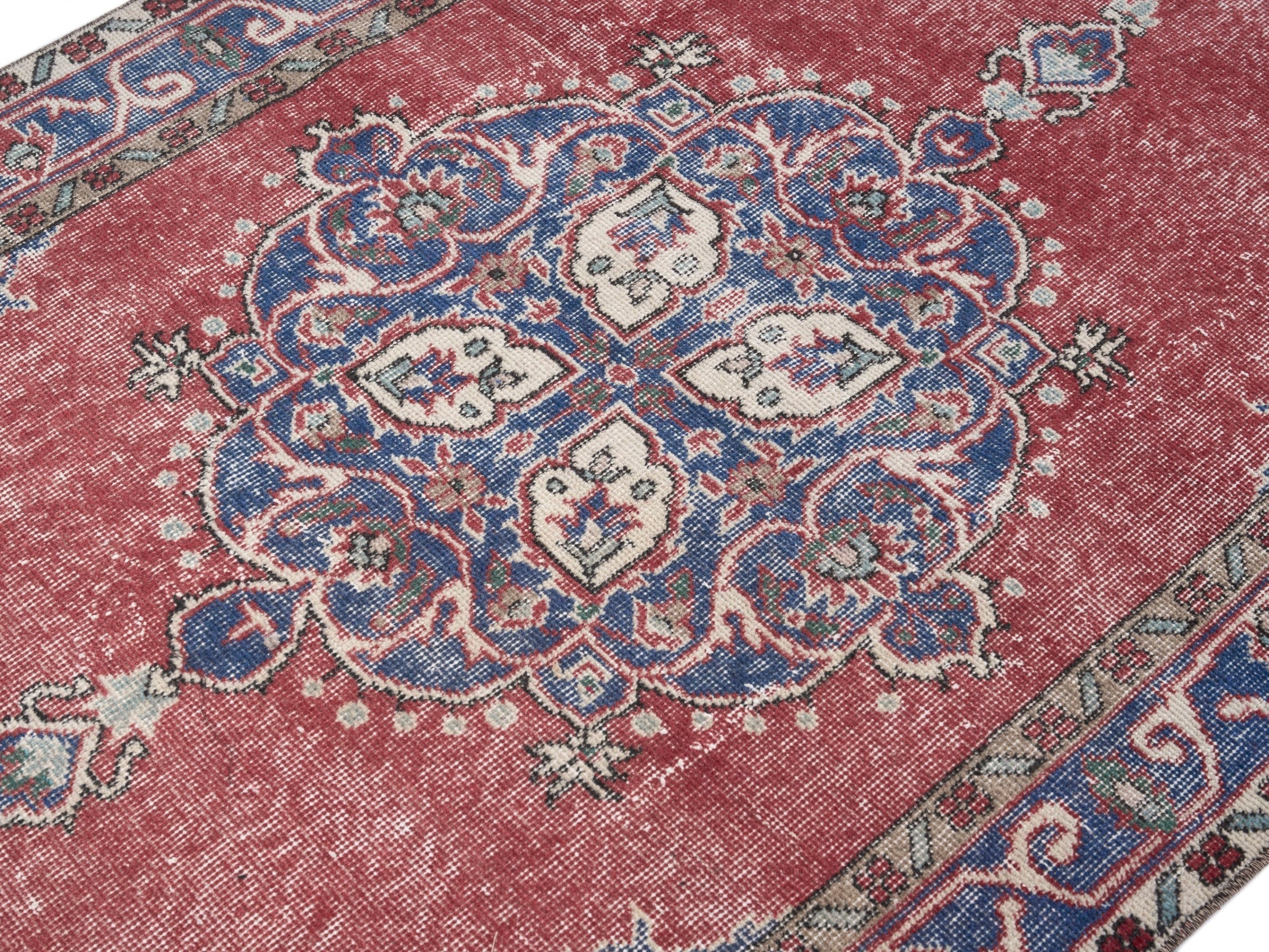 Turkish Isparta area rug in rose and navy, view 5 of 10