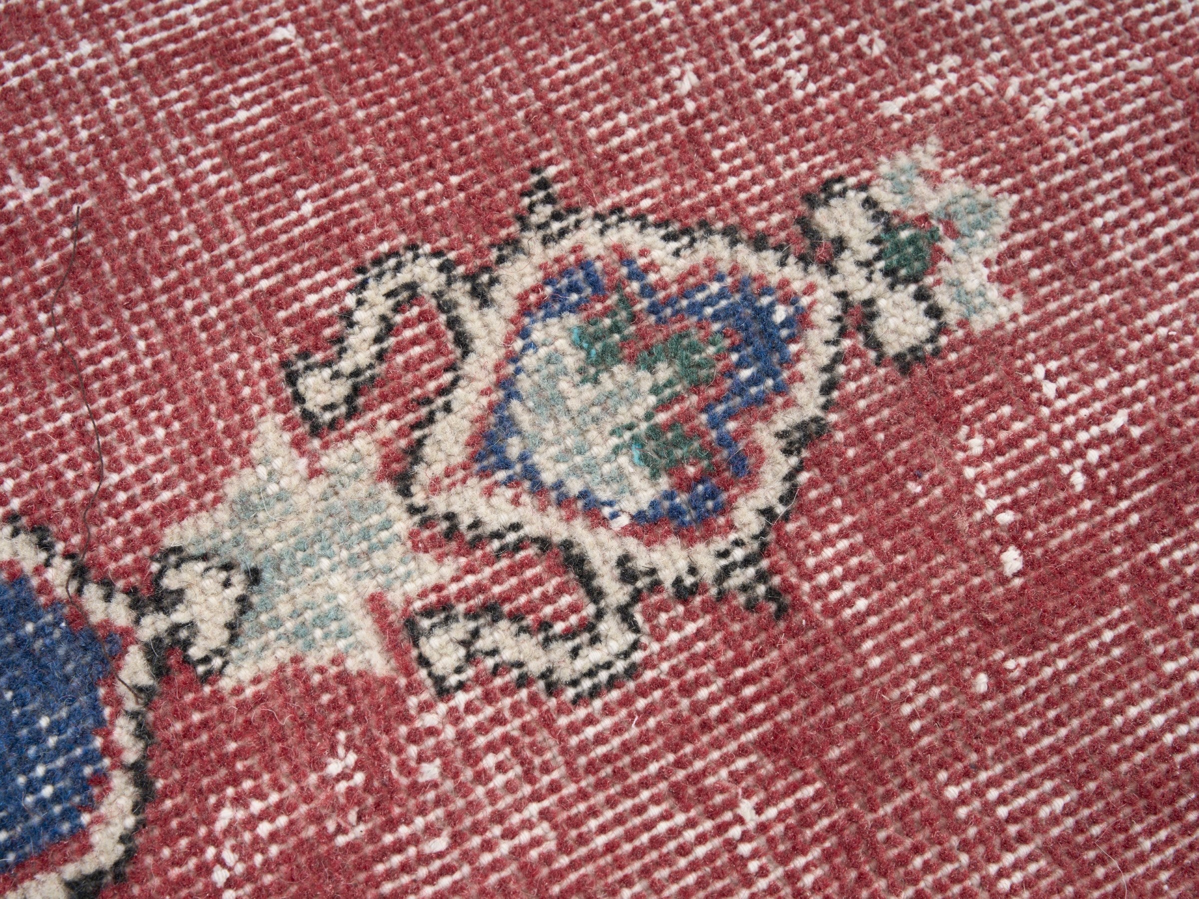 Turkish Isparta area rug in rose and navy, view 7 of 10