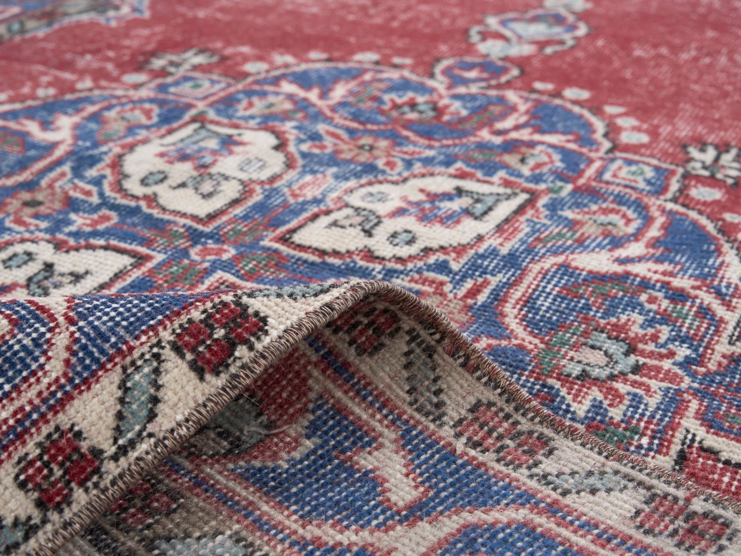 Turkish Isparta area rug in rose and navy, view 9 of 10