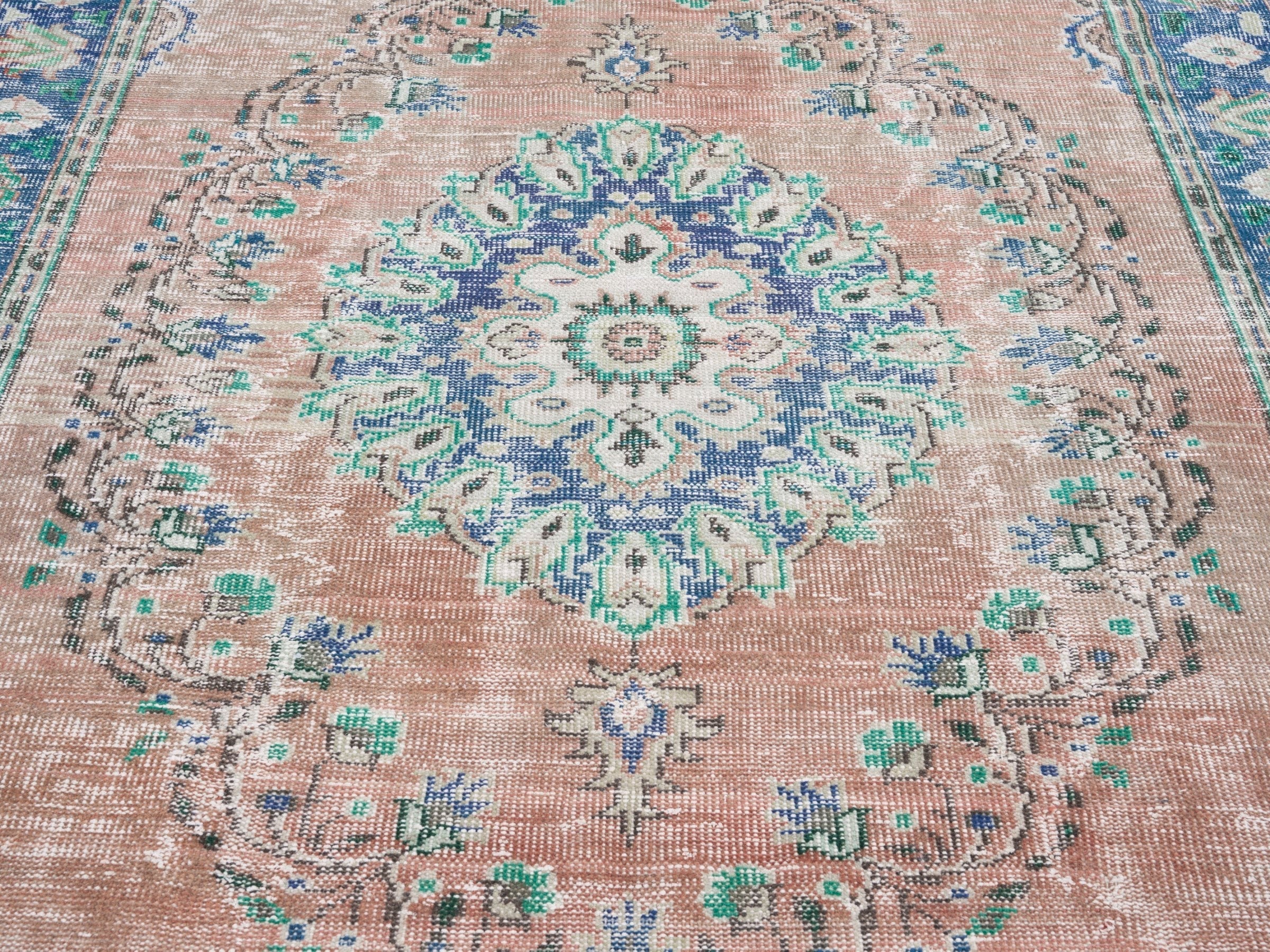 Turkish Manisa area rug in muted pink and navy, view 4 of 10