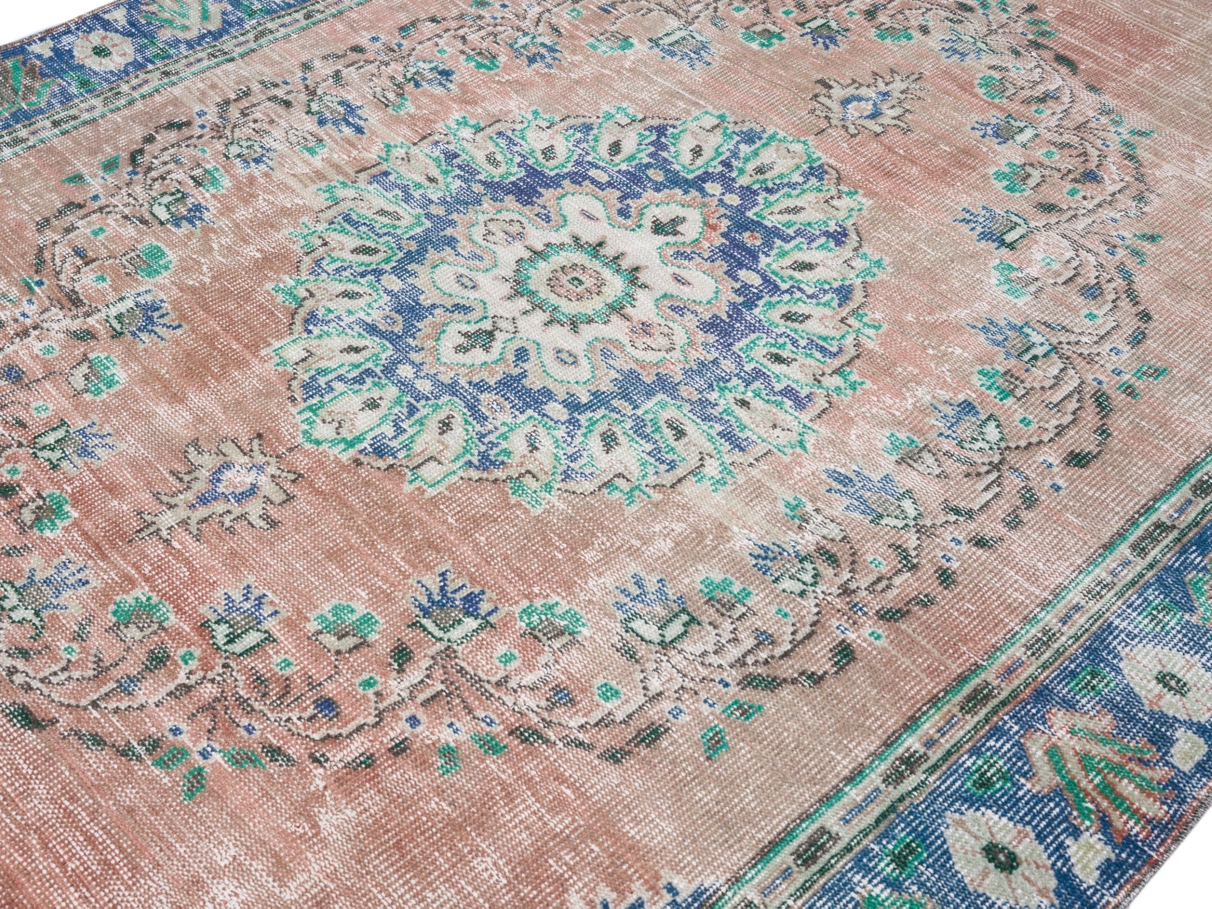 Turkish Manisa area rug in muted pink and navy, view 5 of 10