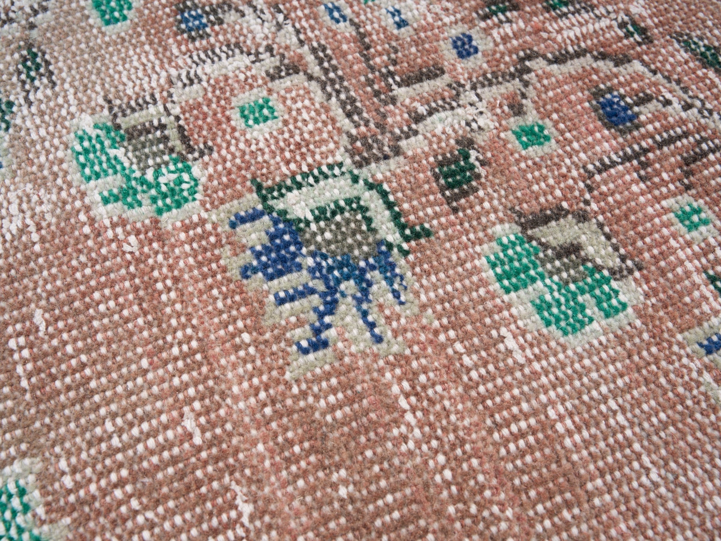 Turkish Manisa area rug in muted pink and navy, view 7 of 10