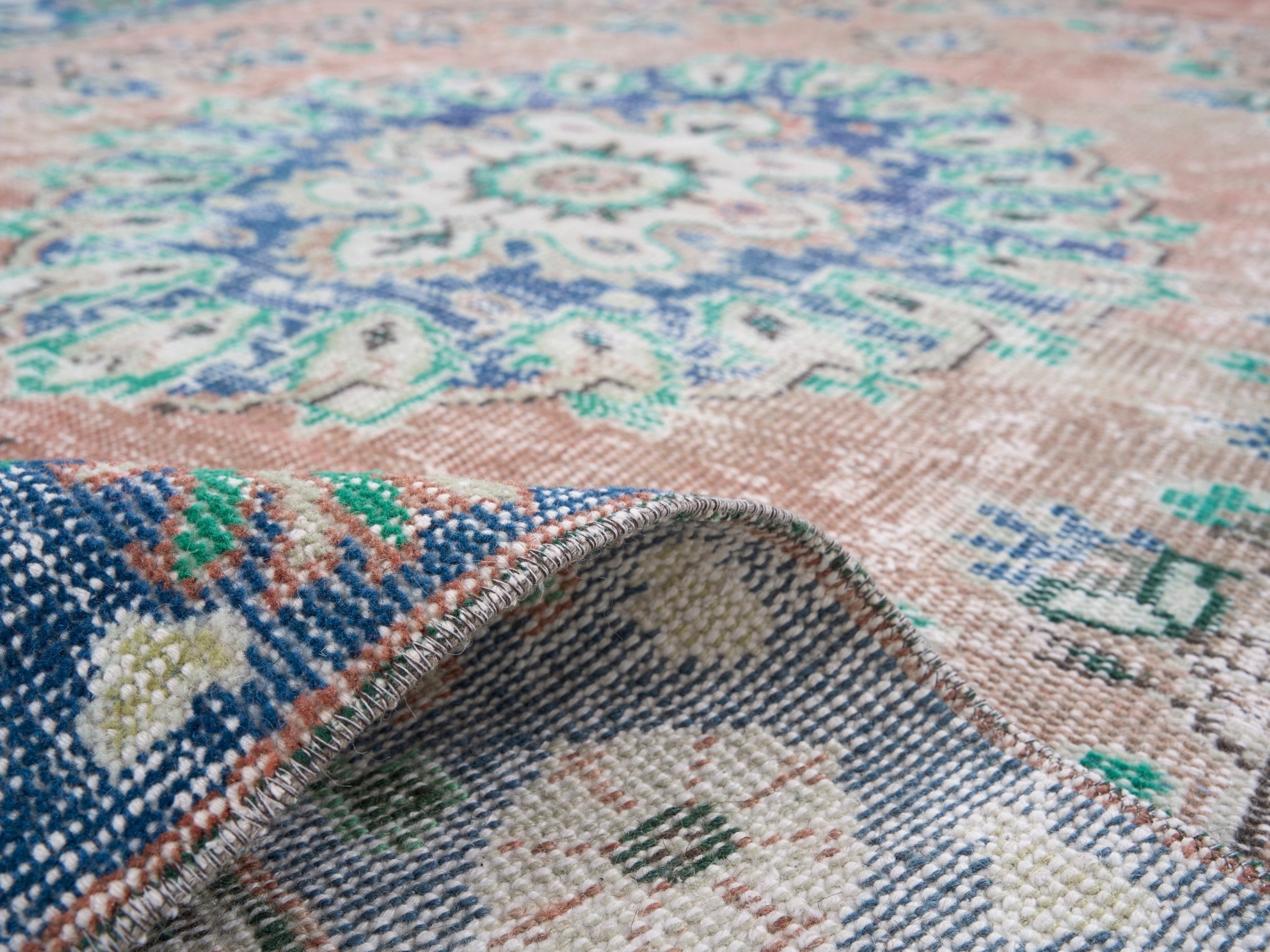 Turkish Manisa area rug in muted pink and navy, view 9 of 10