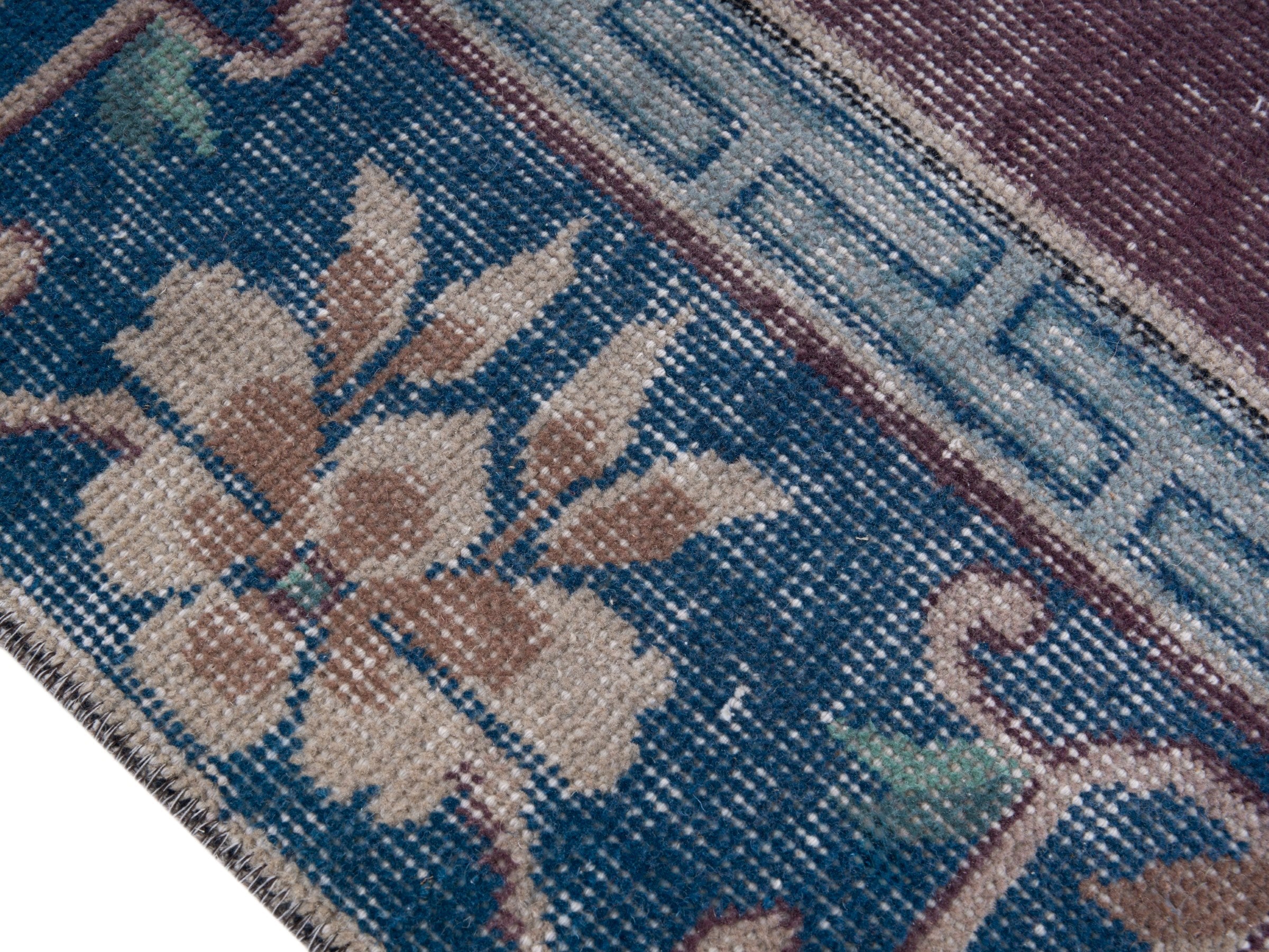 Turkish Isparta area rug in burgundy and navy, view 6 of 10