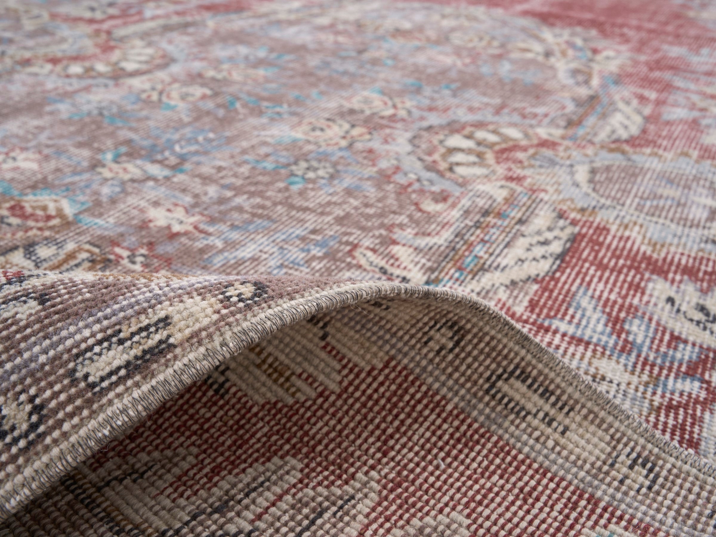 Turkish Isparta area rug in faded red and muted pink, view 9 of 10