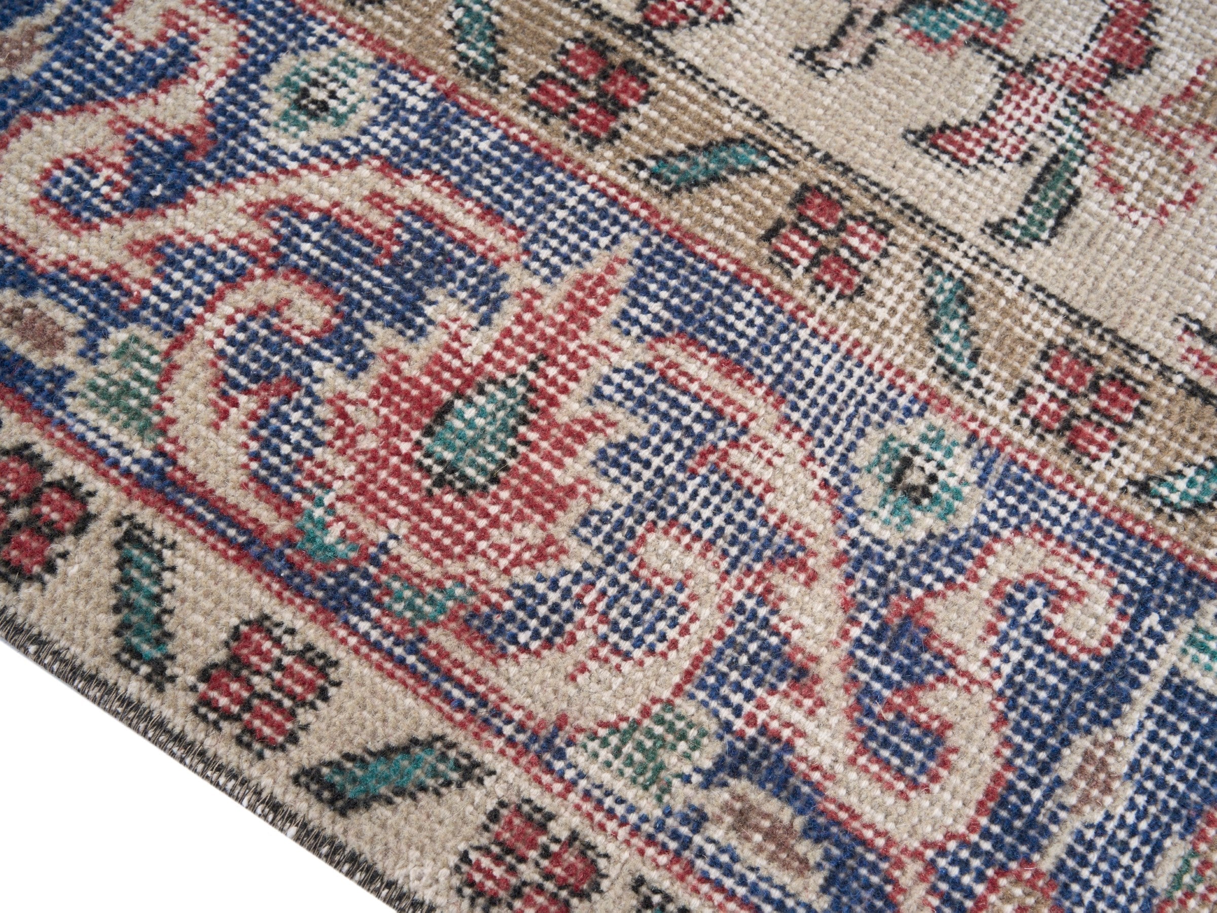 Turkish Isparta area rug in dusty rose and navy, view 6 of 10