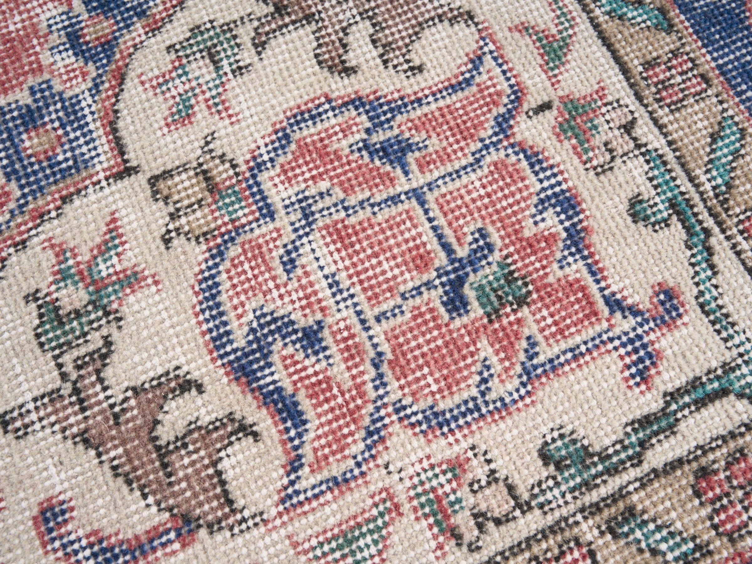 Turkish Isparta area rug in dusty rose and navy, view 7 of 10