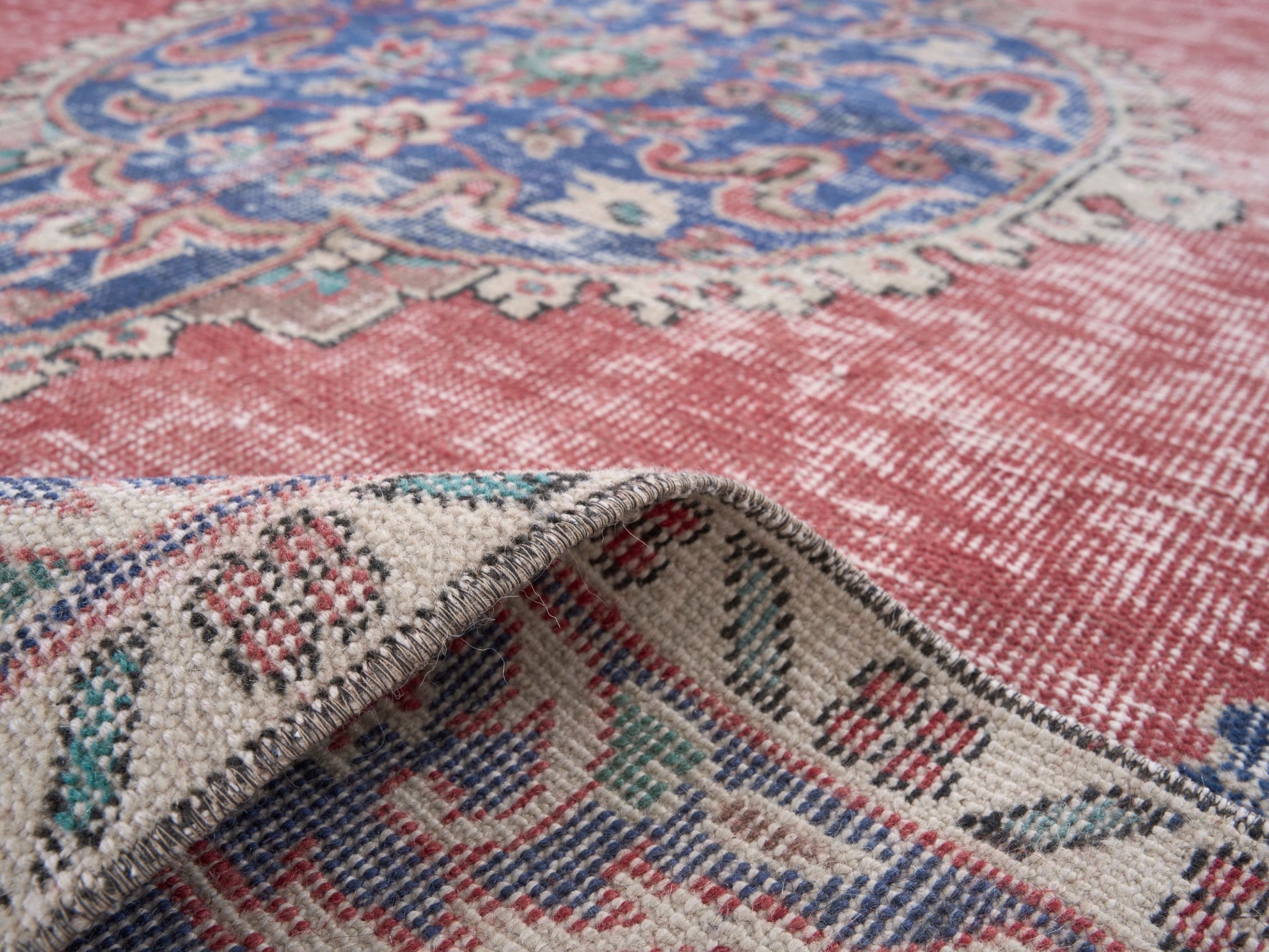 Turkish Isparta area rug in dusty rose and navy, view 9 of 10
