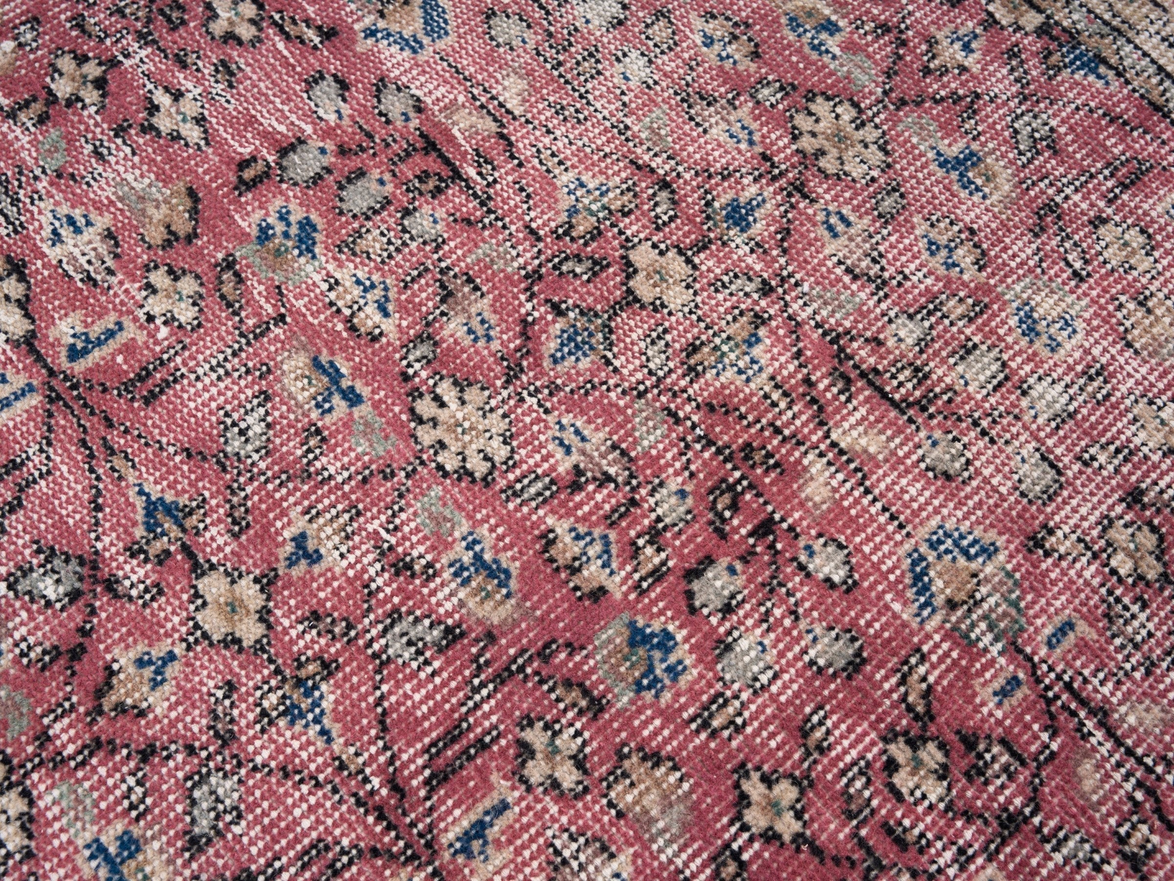 Turkish Isparta area rug in faded red and cream, view 7 of 10