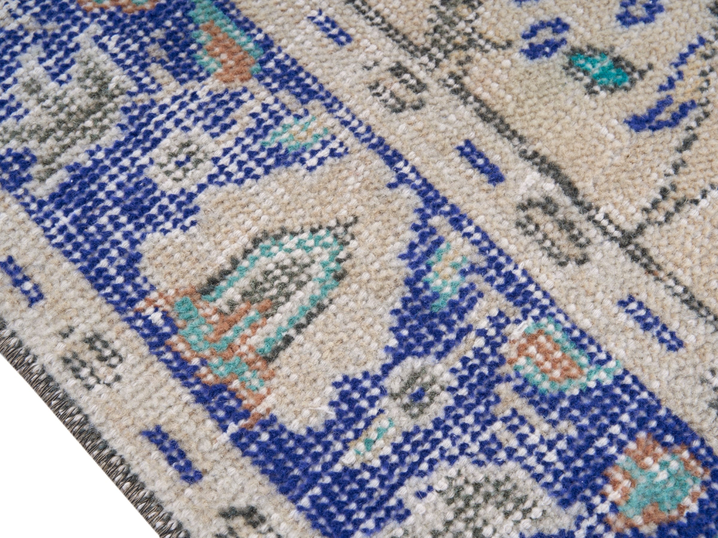 Turkish Manisa area rug in cream and navy, view 6 of 10