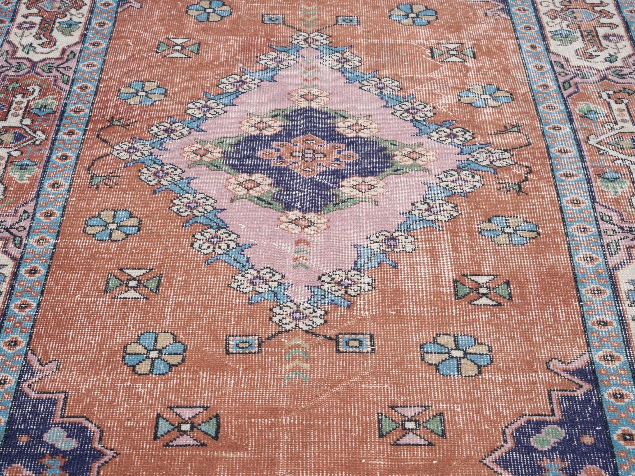 Turkish Isparta area rug in rust and navy, view 4 of 10