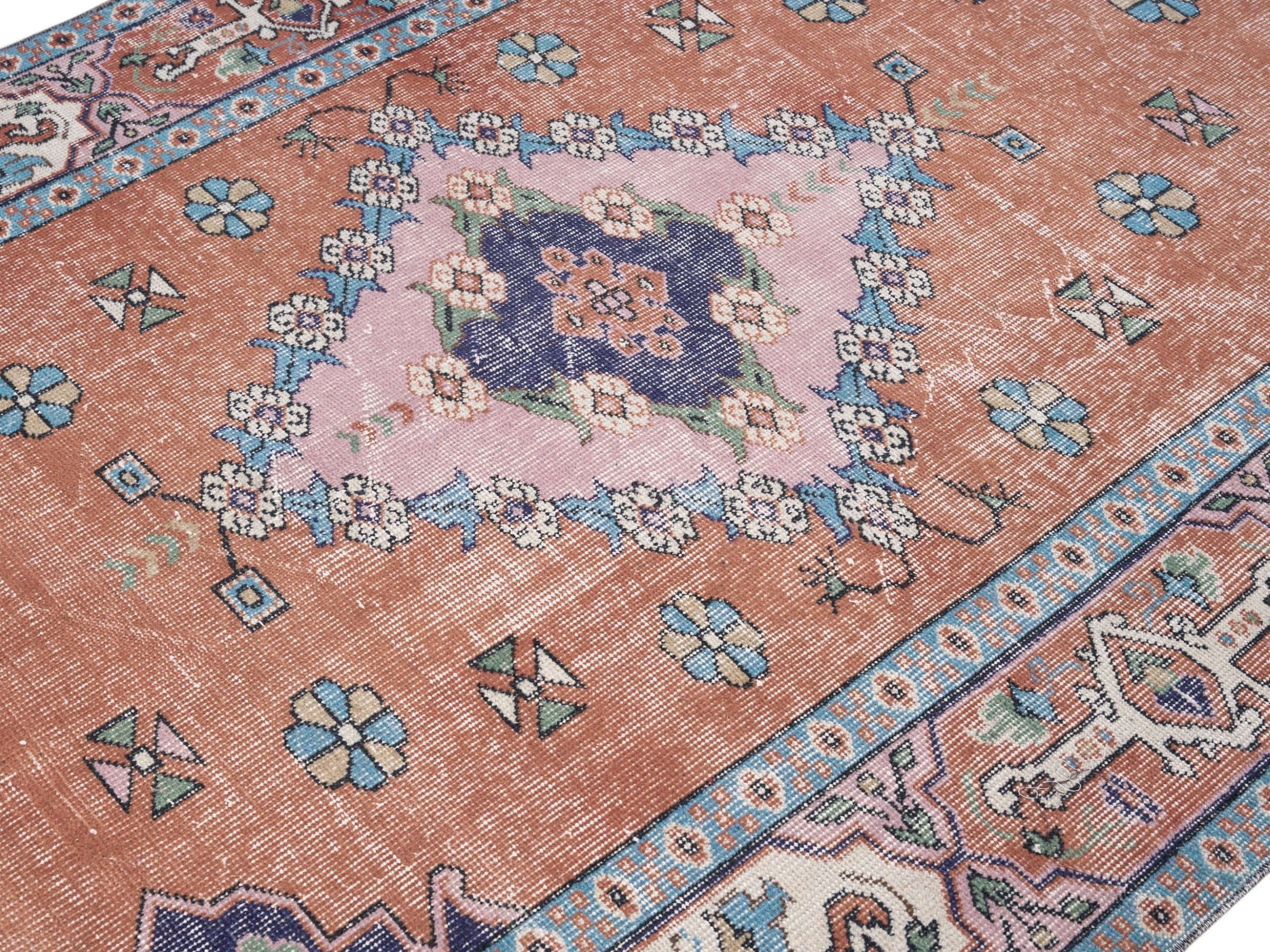 Turkish Isparta area rug in rust and navy, view 5 of 10