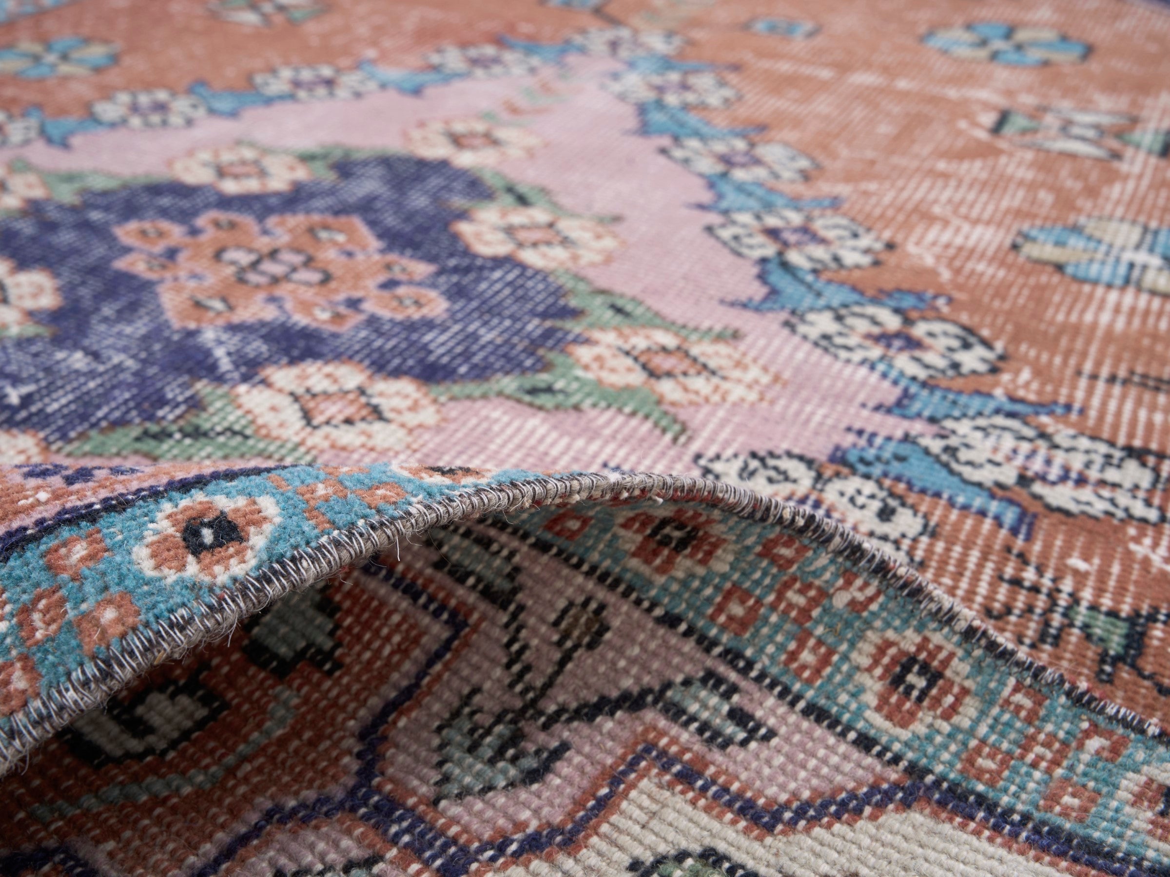 Turkish Isparta area rug in rust and navy, view 9 of 10
