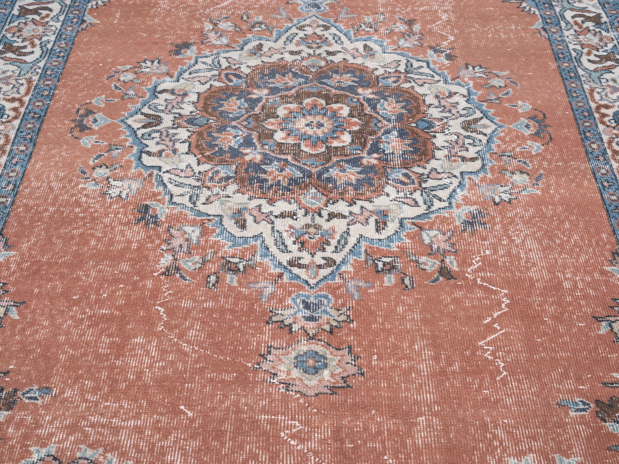 Turkish Isparta area rug in rust and navy, view 4 of 10
