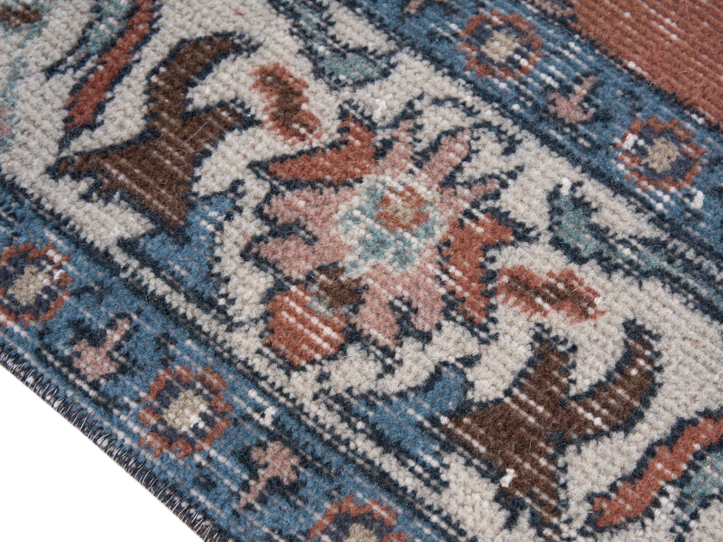 Turkish Isparta area rug in rust and navy, view 6 of 10