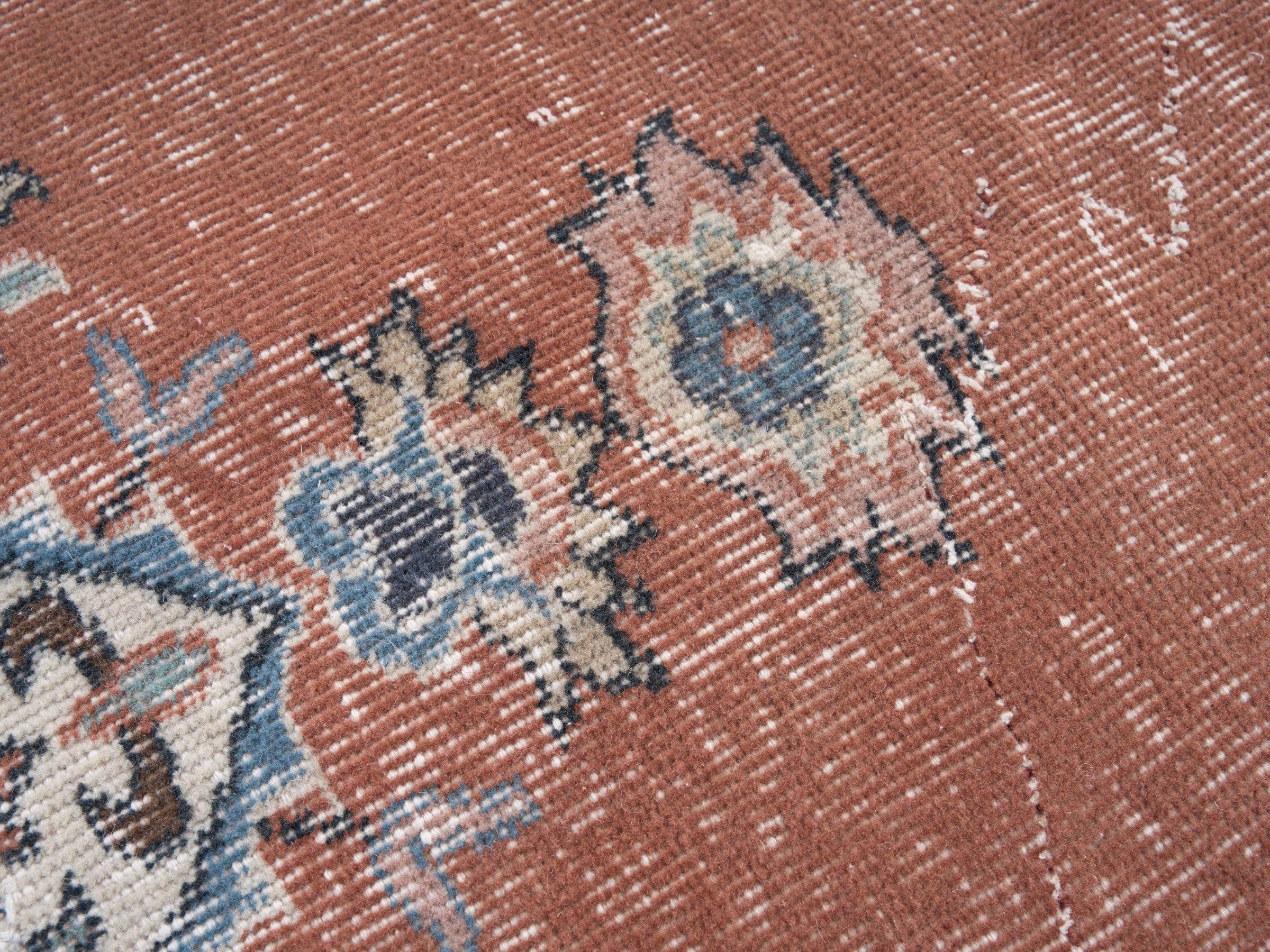 Turkish Isparta area rug in rust and navy, view 7 of 10