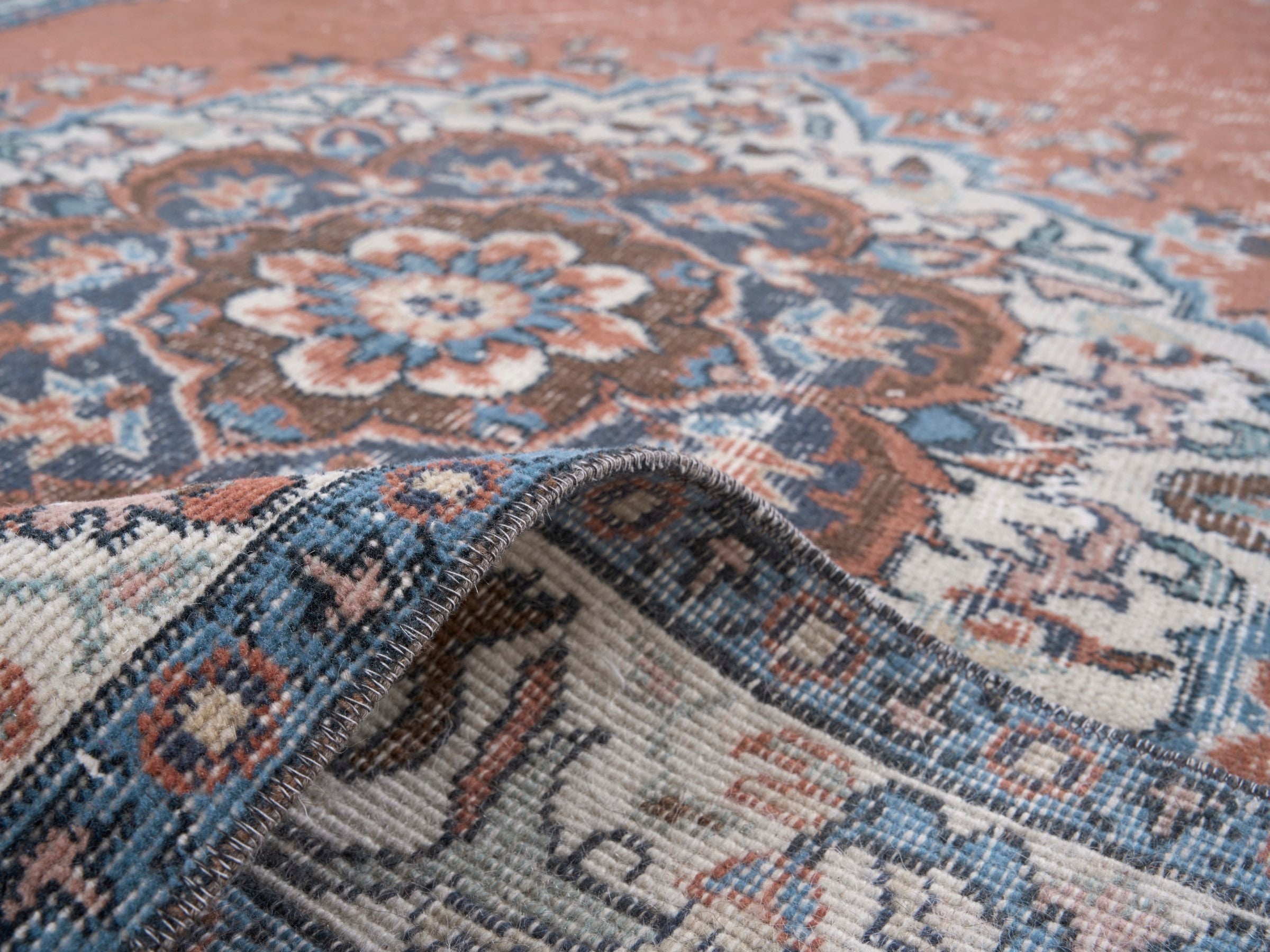 Turkish Isparta area rug in rust and navy, view 9 of 10