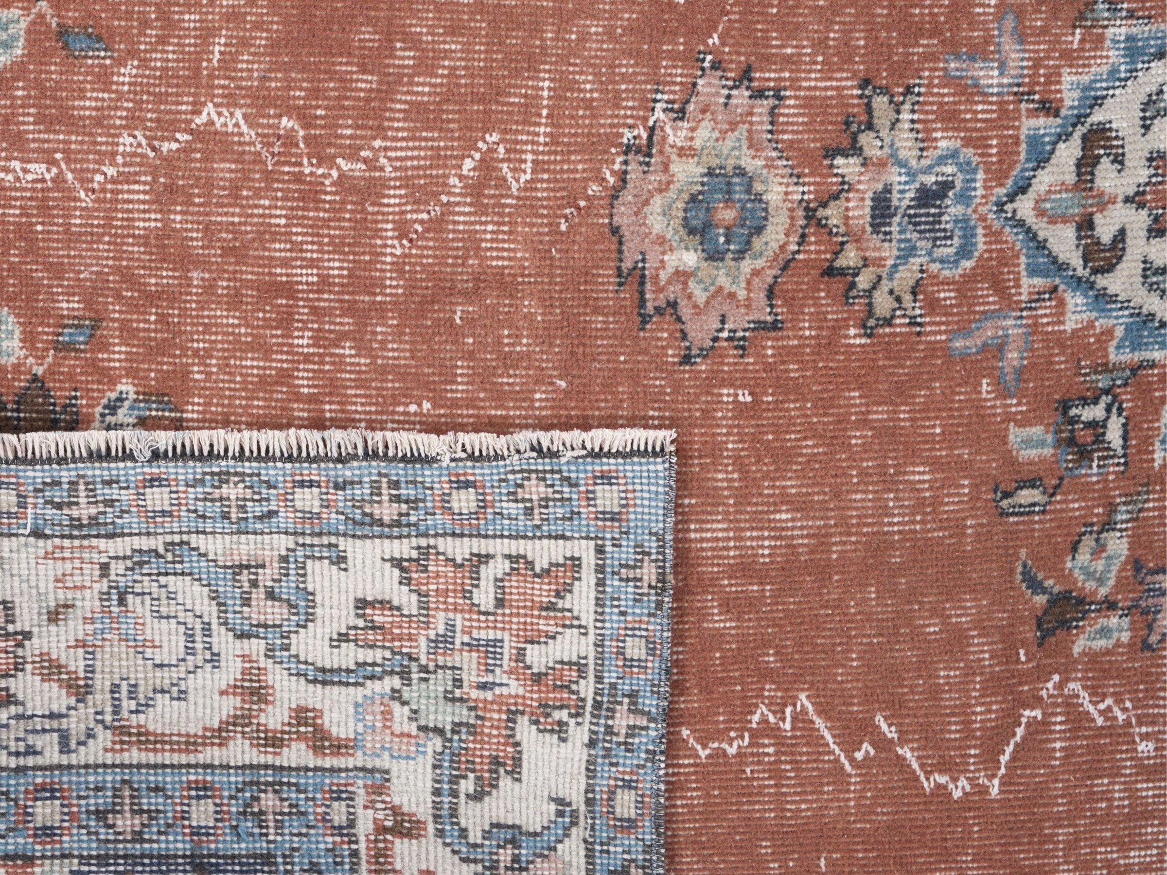 Turkish Isparta area rug in rust and navy, view 10 of 10