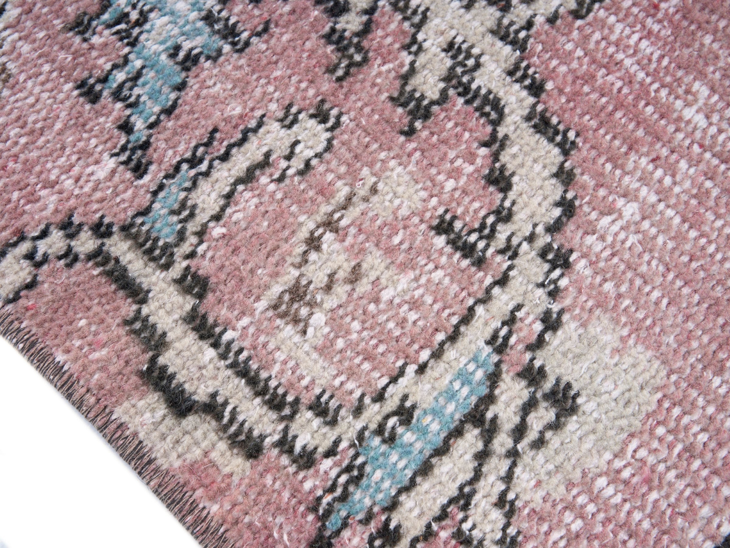 Turkish Manisa area rug in dusty rose and muted pink, view 6 of 10