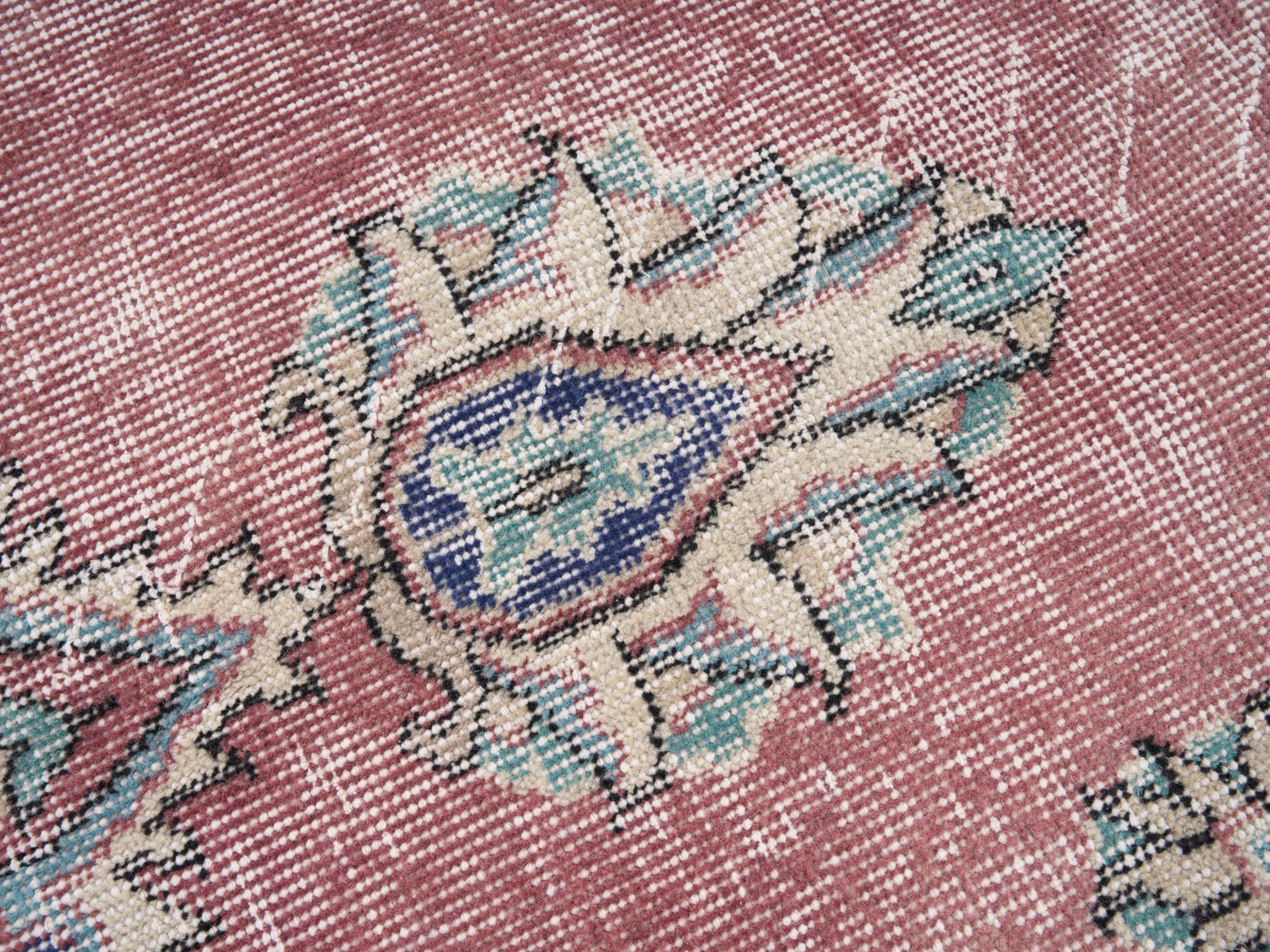 Turkish Isparta area rug in dusty rose and navy, view 7 of 10