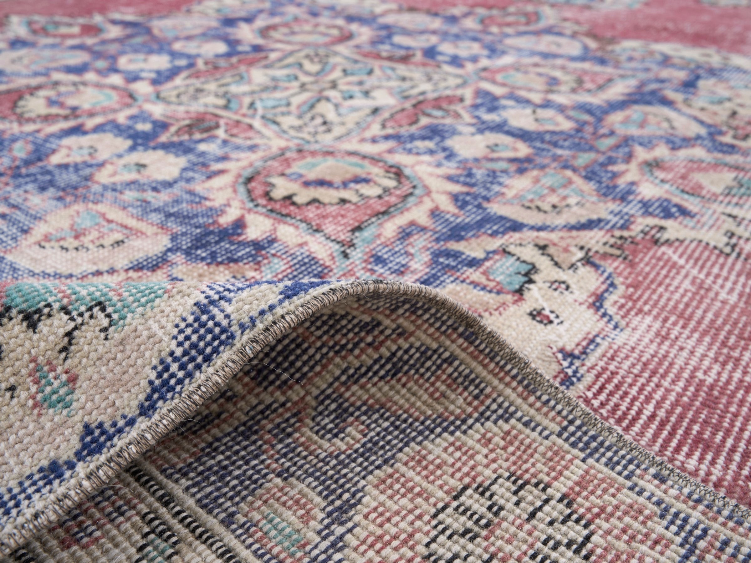 Turkish Isparta area rug in dusty rose and navy, view 9 of 10
