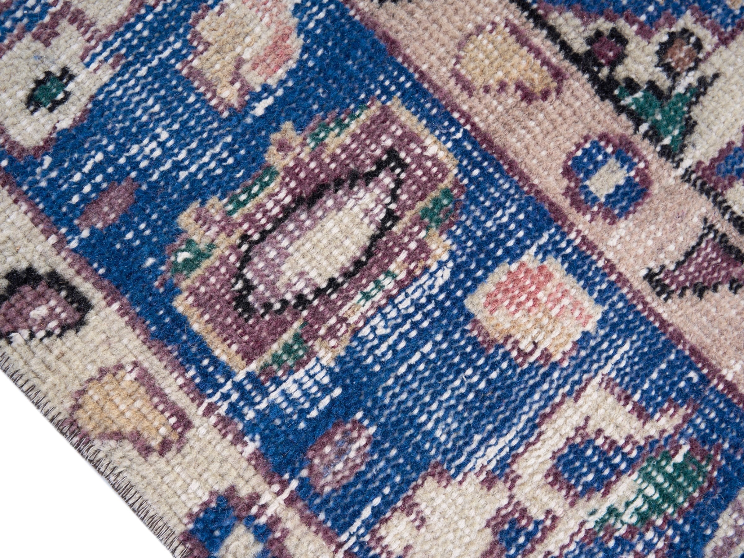 Turkish Isparta area rug in dusty rose and navy, view 6 of 10