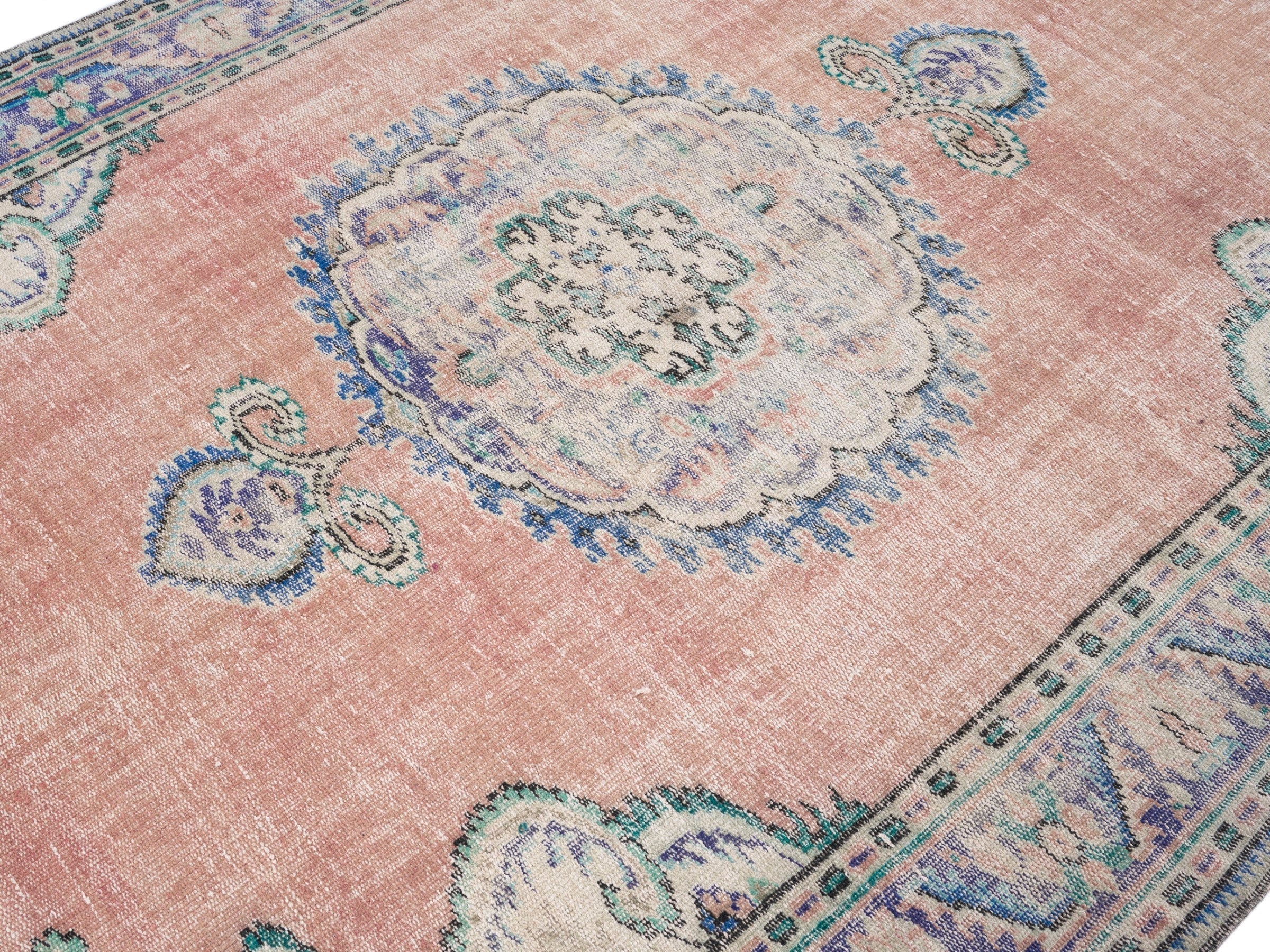 Turkish Manisa area rug in dusty rose and navy, view 5 of 10