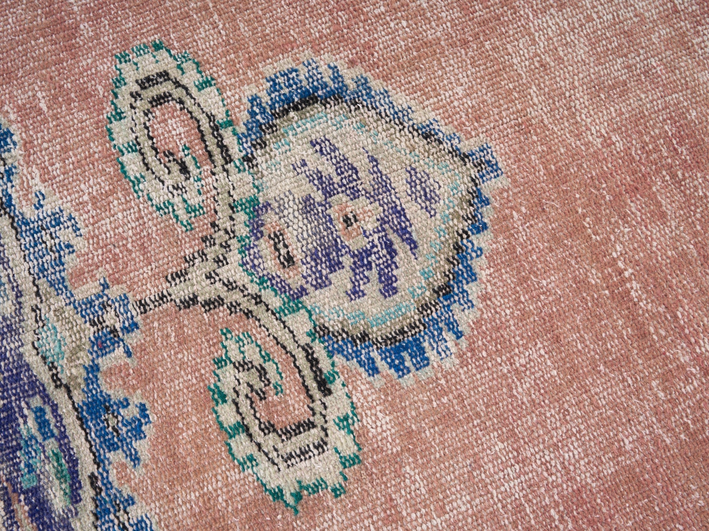Turkish Manisa area rug in dusty rose and navy, view 7 of 10