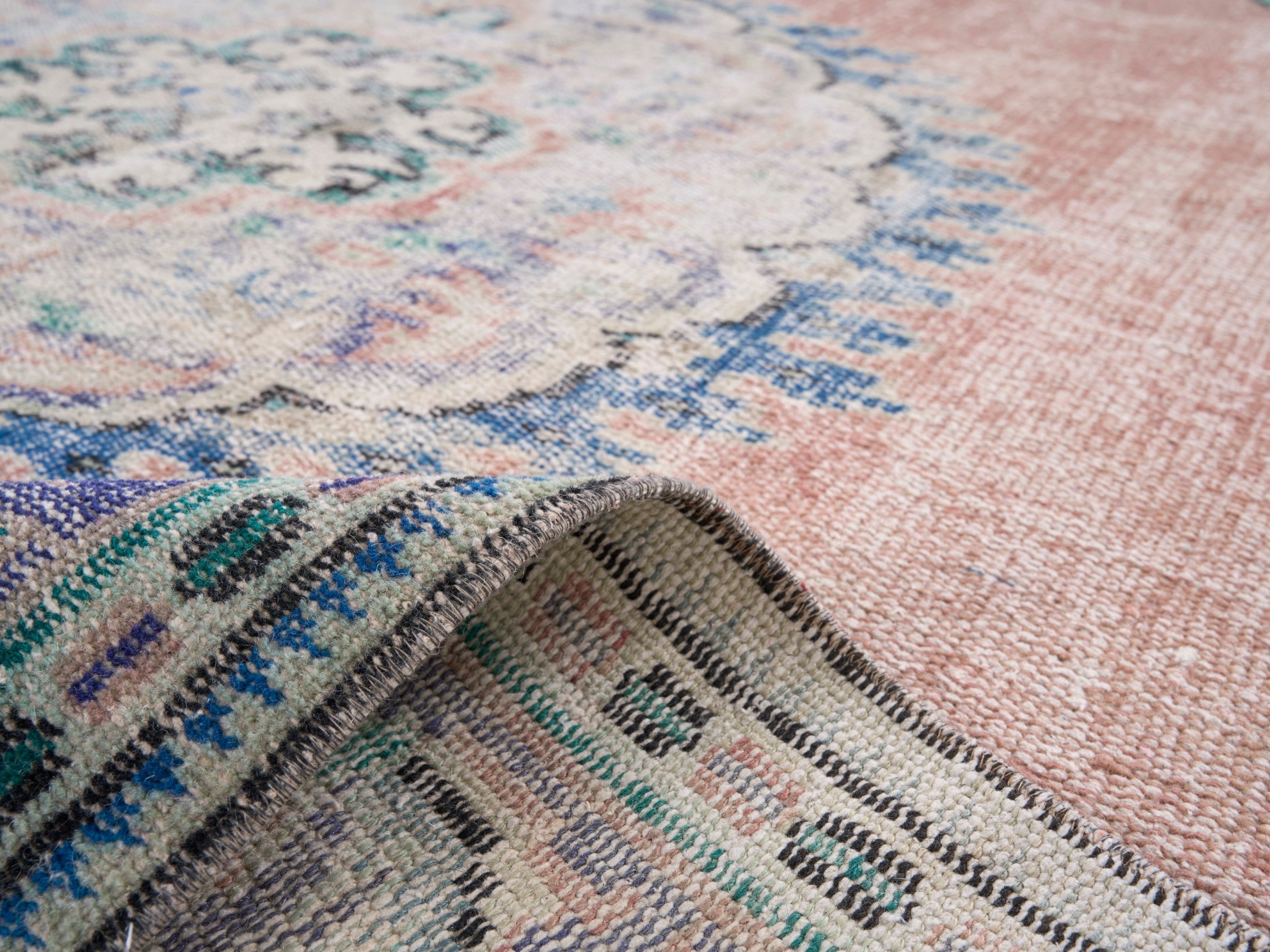 Turkish Manisa area rug in dusty rose and navy, view 9 of 10