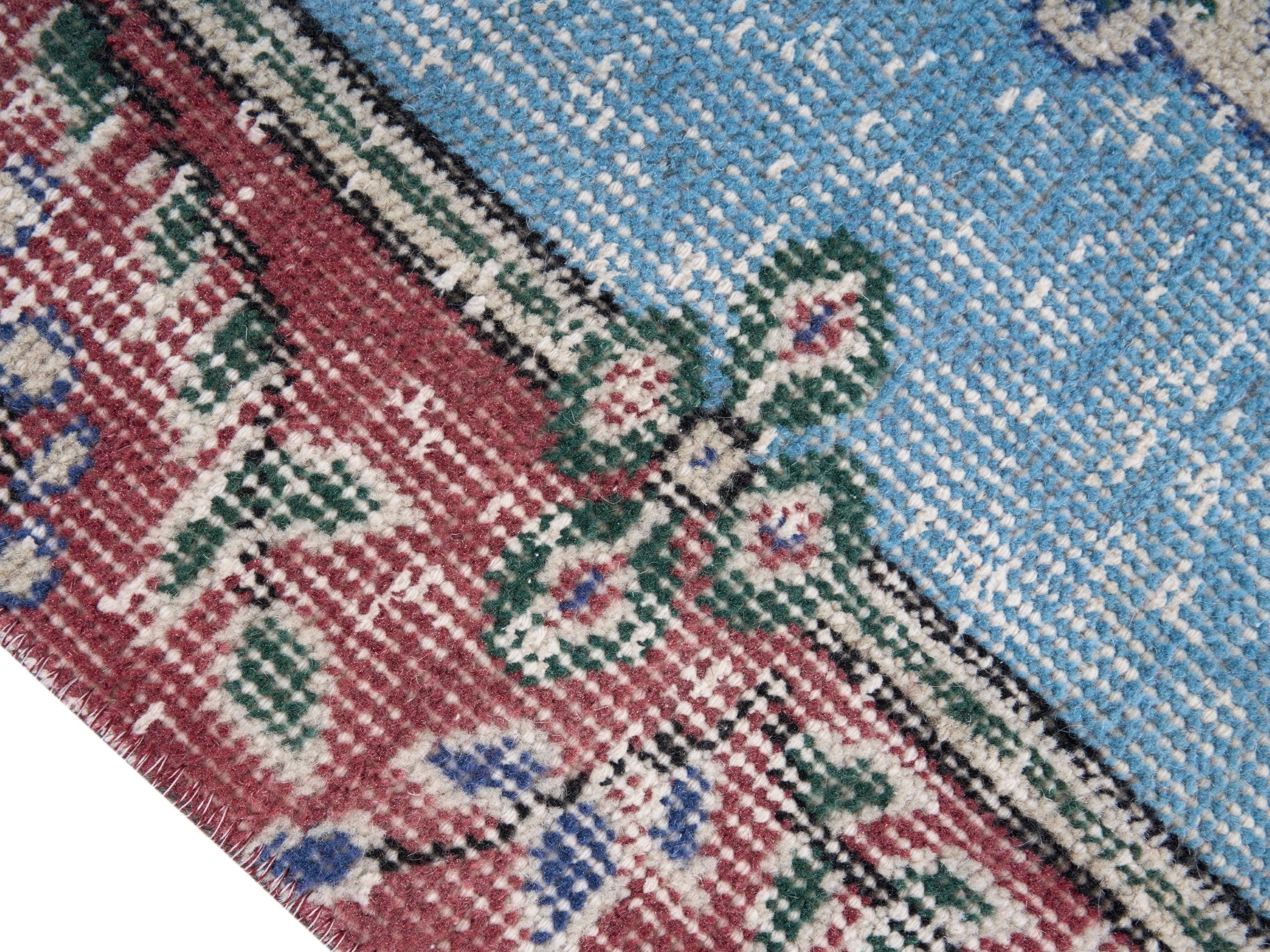 Turkish Isparta area rug in faded red and sky, view 6 of 10